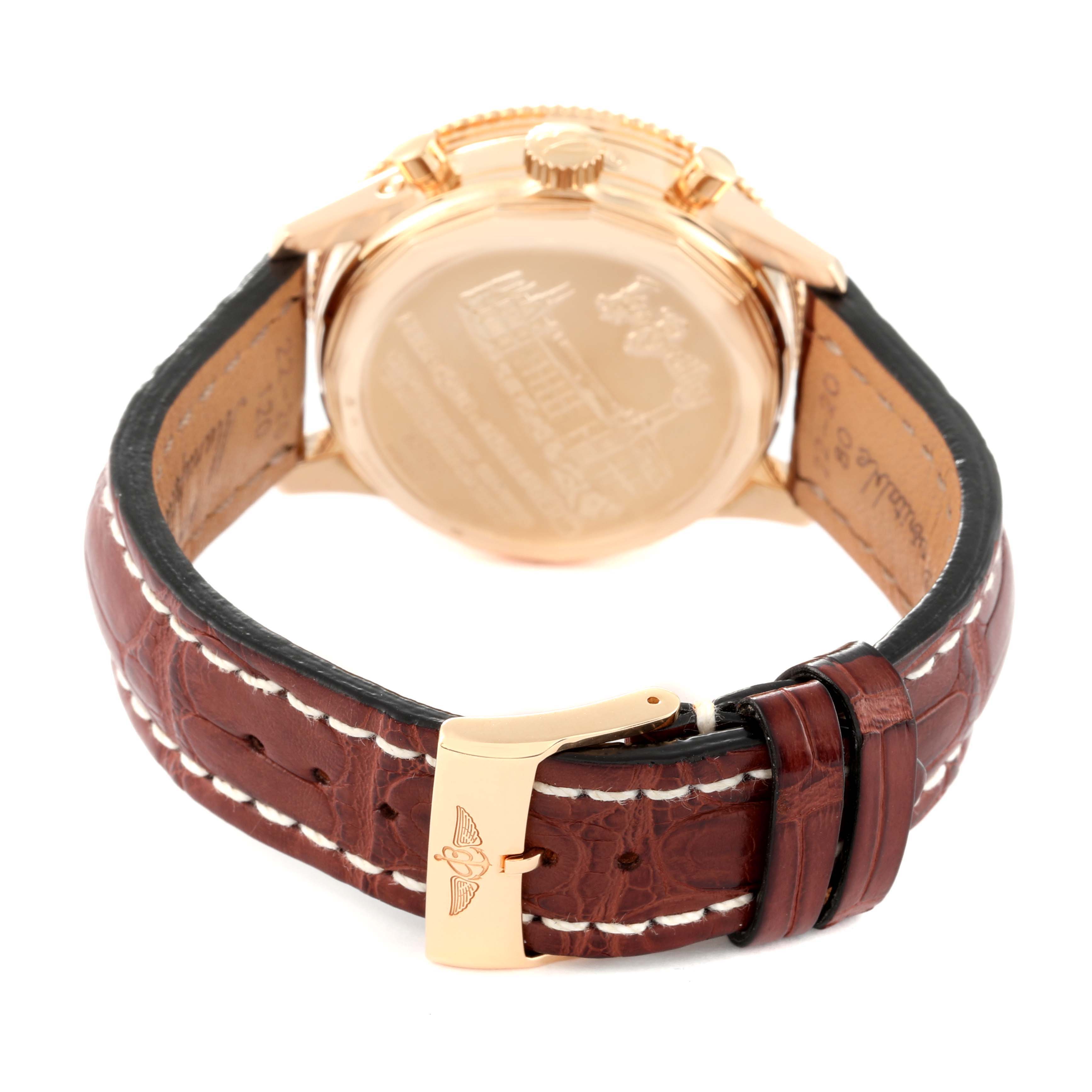 The image shows the back side of a Breitling Navitimer H19350 Men's Rose Gold Silver Dial H19350 Men's Rose Gold Silver Dial watch, highlighting the case back and brown leather strap with a buckle.