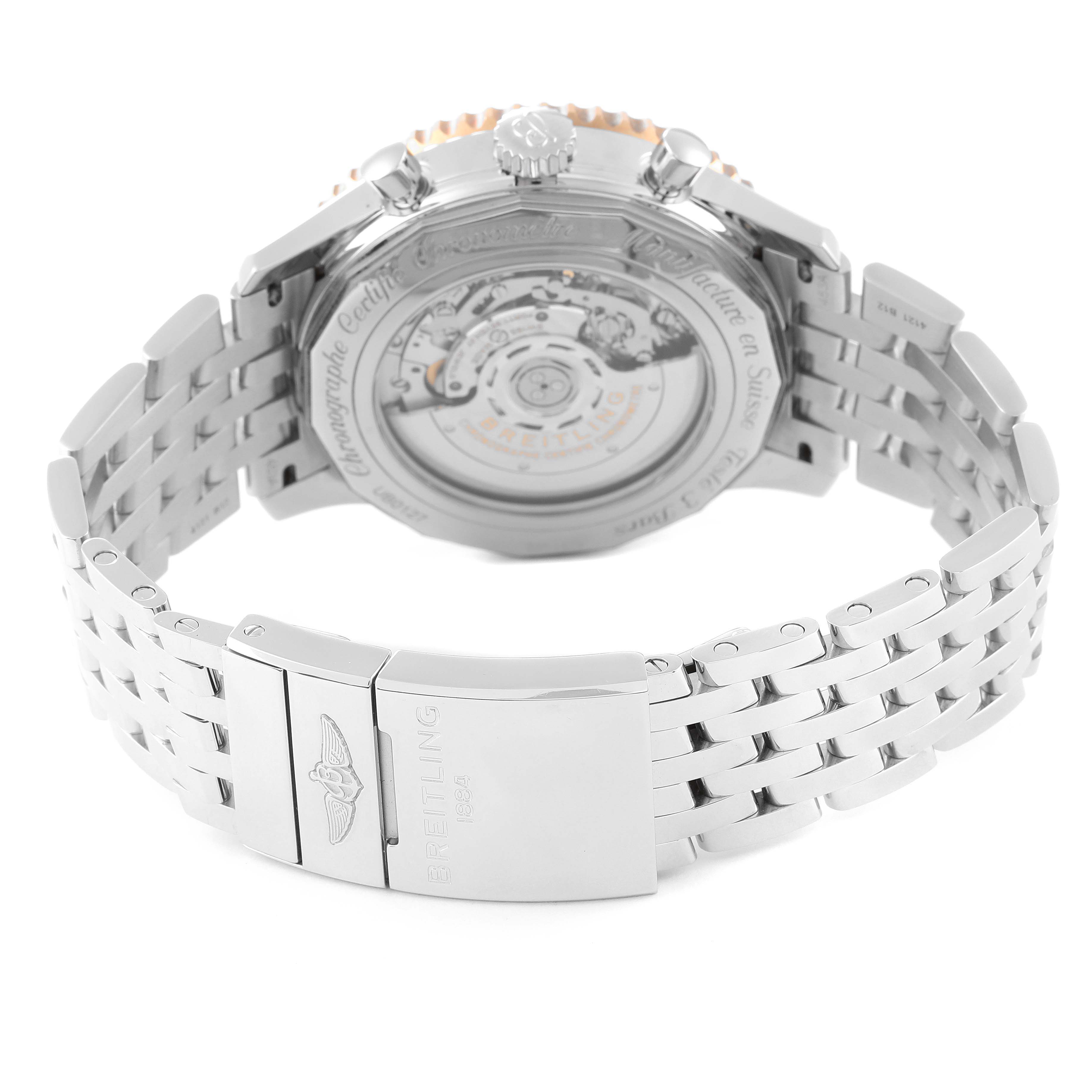 The image shows the back side of a Breitling Navitimer UB0127 Men
s Stainless Steel Black Dial UB0127 Men
s Stainless Steel Black Dial watch, highlighting its clasp and exposed movement.