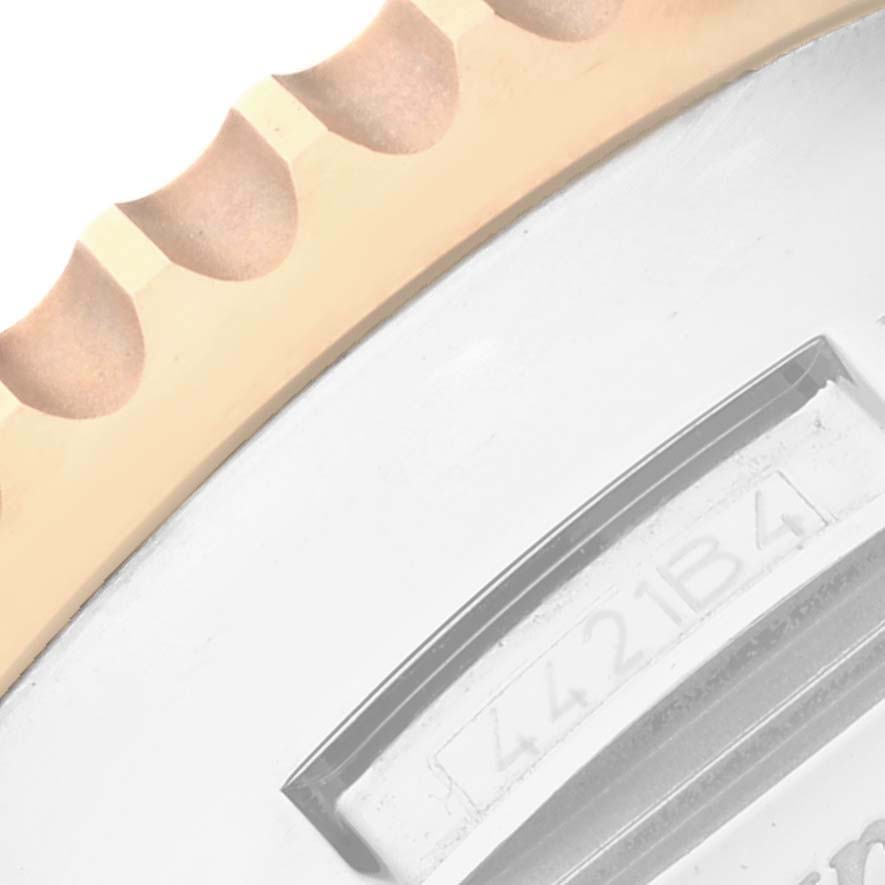 This image shows a close-up of the bezel and part of the case back of the Breitling Navitimer UB0127 Men
s Stainless Steel Black Dial UB0127 Men
s Stainless Steel Black Dial watch.