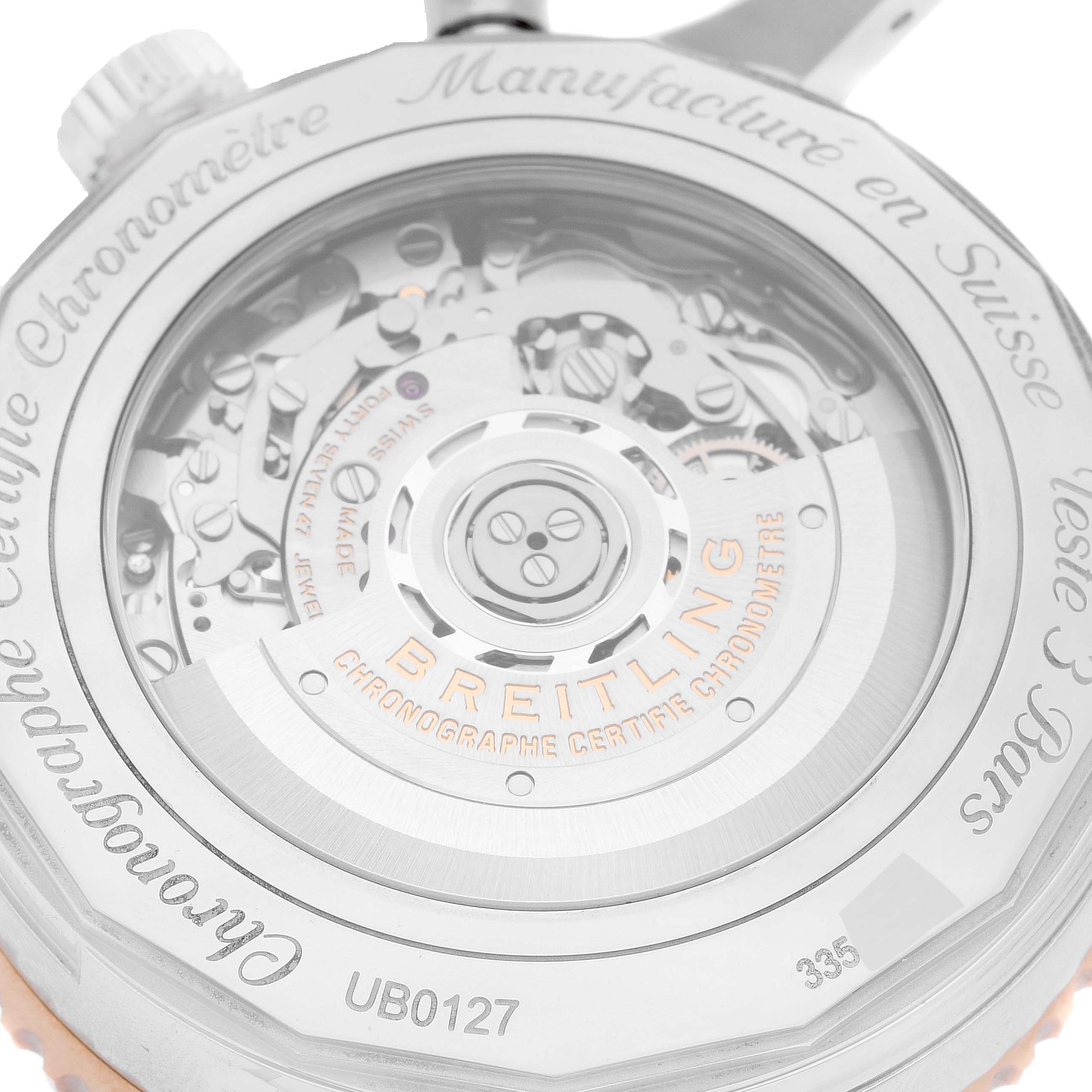 The image shows the case back of a Breitling Navitimer UB0127 Men
s Stainless Steel Black Dial UB0127 Men
s Stainless Steel Black Dial watch, revealing its internal mechanics.