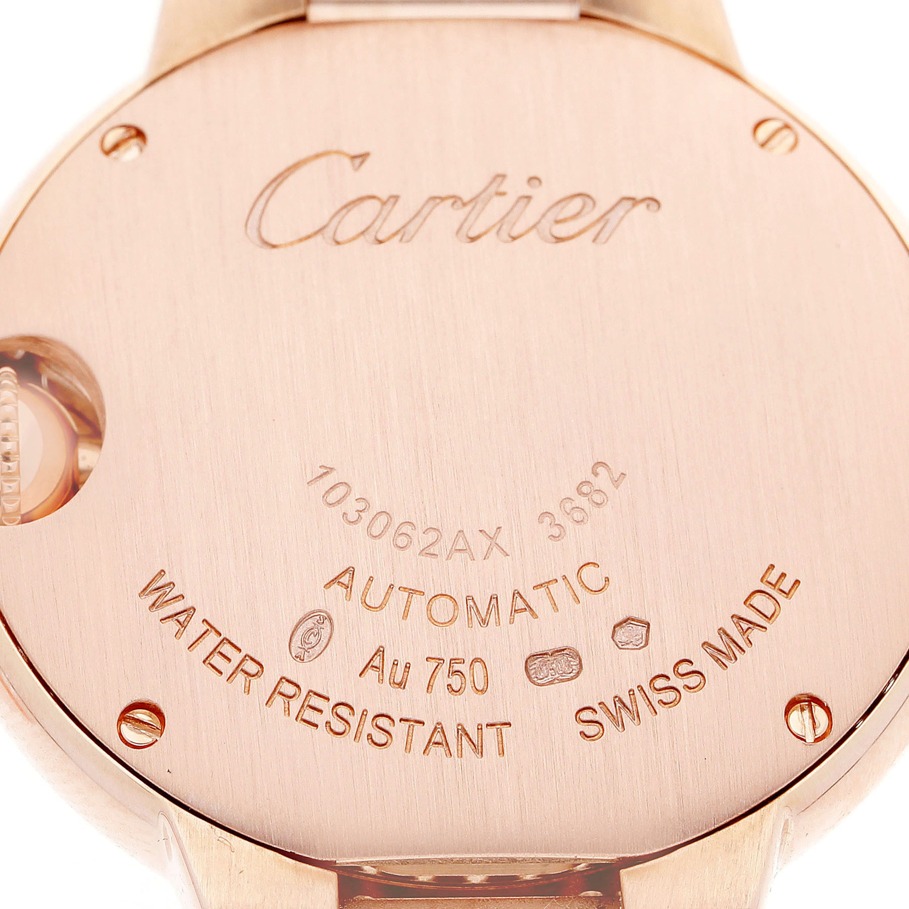The image shows the back case of a Cartier Ballon Bleu WJBB0036 Women's Rose Gold Silver Dial watch, highlighting engravings and markings.