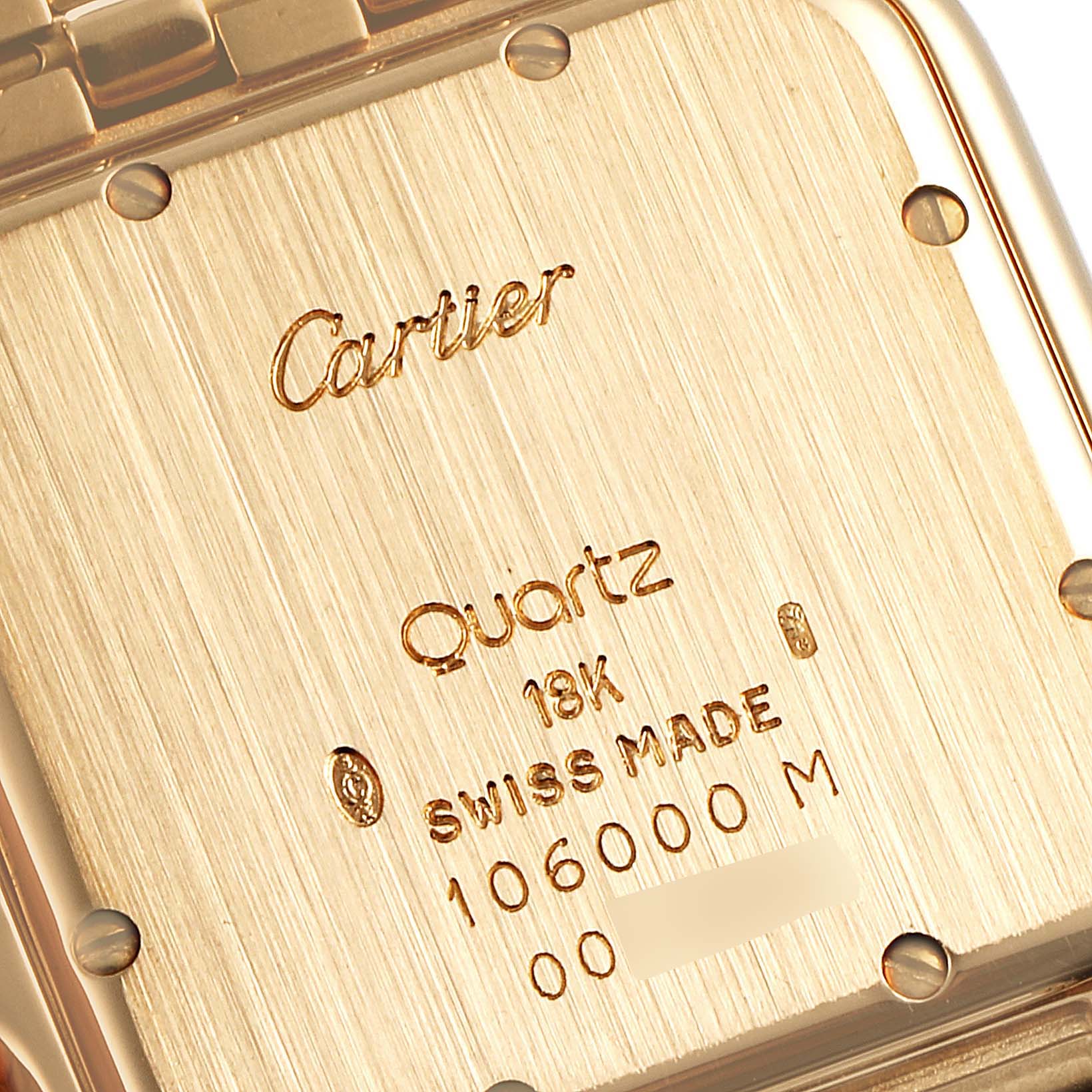 The image shows the back case of a Cartier Panthere W25014B9 Men's Yellow Gold Silver Dial W25014B9 Men's Yellow Gold Silver Dial watch, highlighting its quartz movement and 18k gold composition.