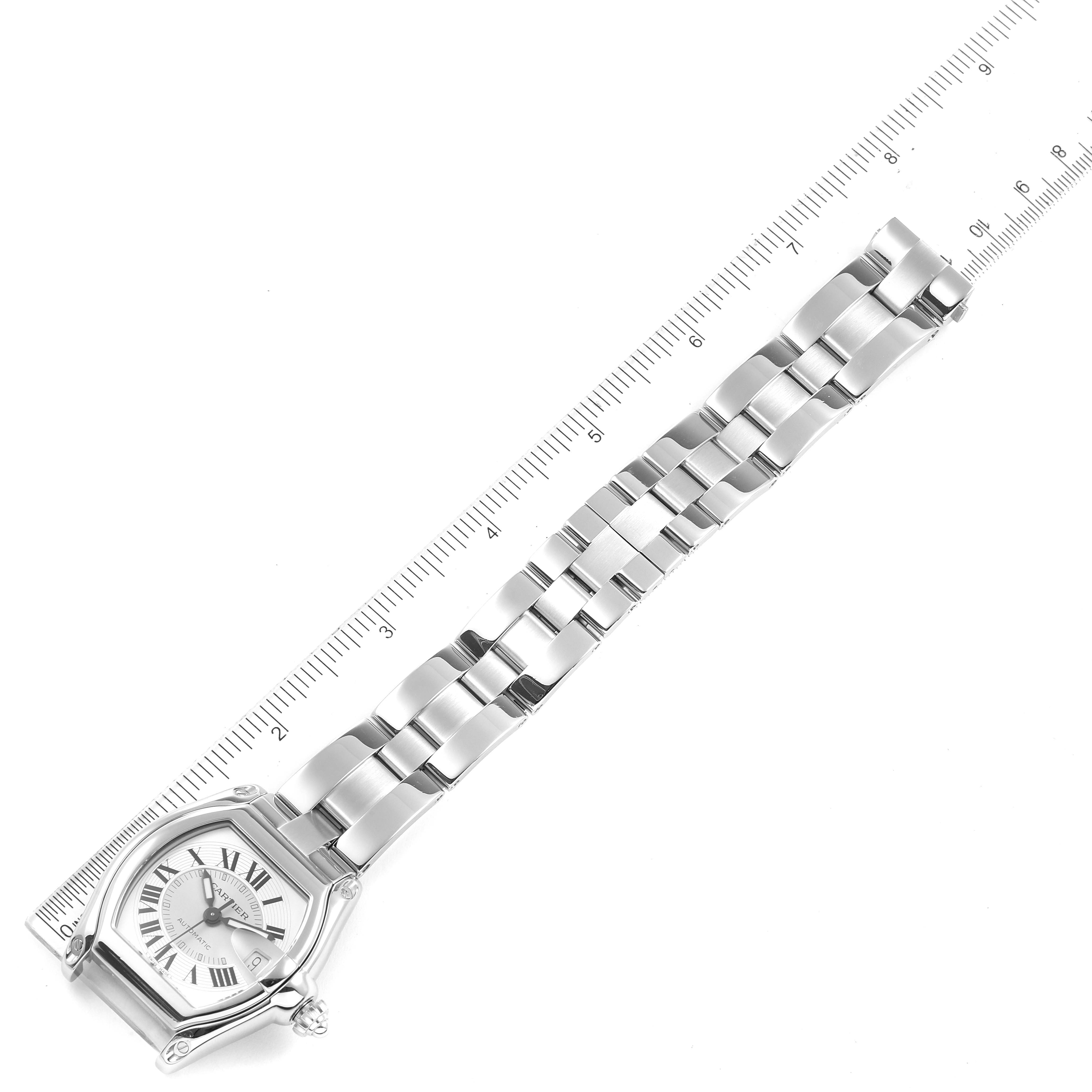 This image shows the face and bracelet of a Roadster model watch by Cartier, laid flat beside a ruler for measurement.