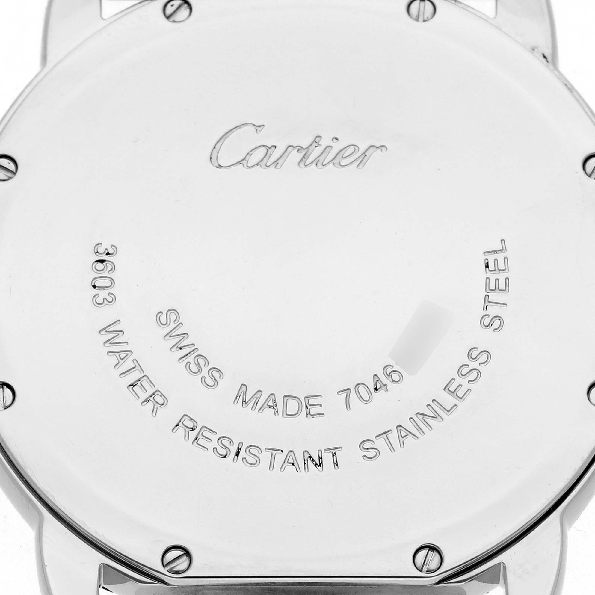 The image shows the back case of the Cartier Ronde W6701005 Men
s Stainless Steel Silver Dial W6701005 Men
s Stainless Steel Silver Dial watch, highlighting engraved details and screws.