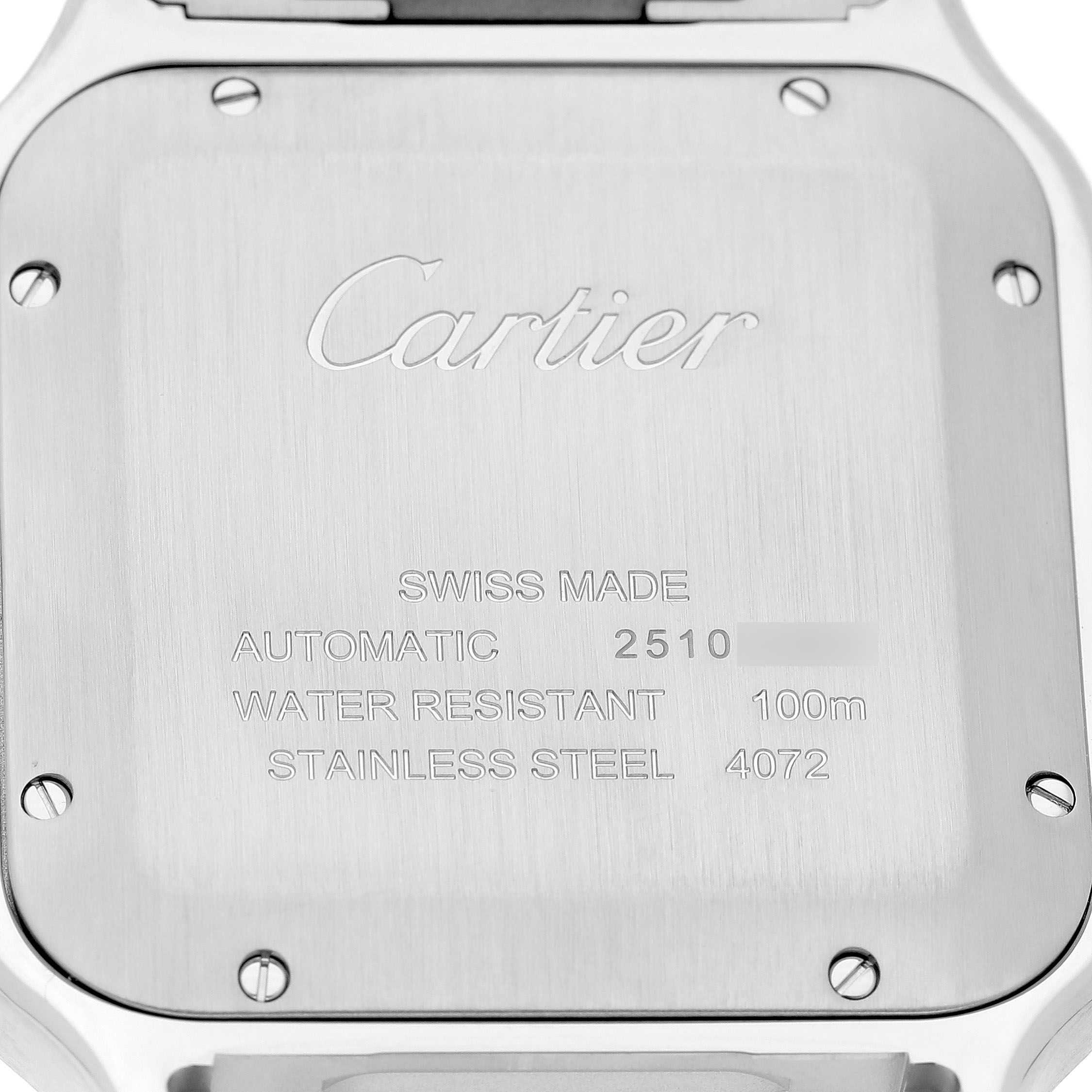 The image shows the back of a Cartier Santos WSSA0030 Men's Stainless Steel Black Dial watch, highlighting its brushed stainless steel case and engraved specifications.
