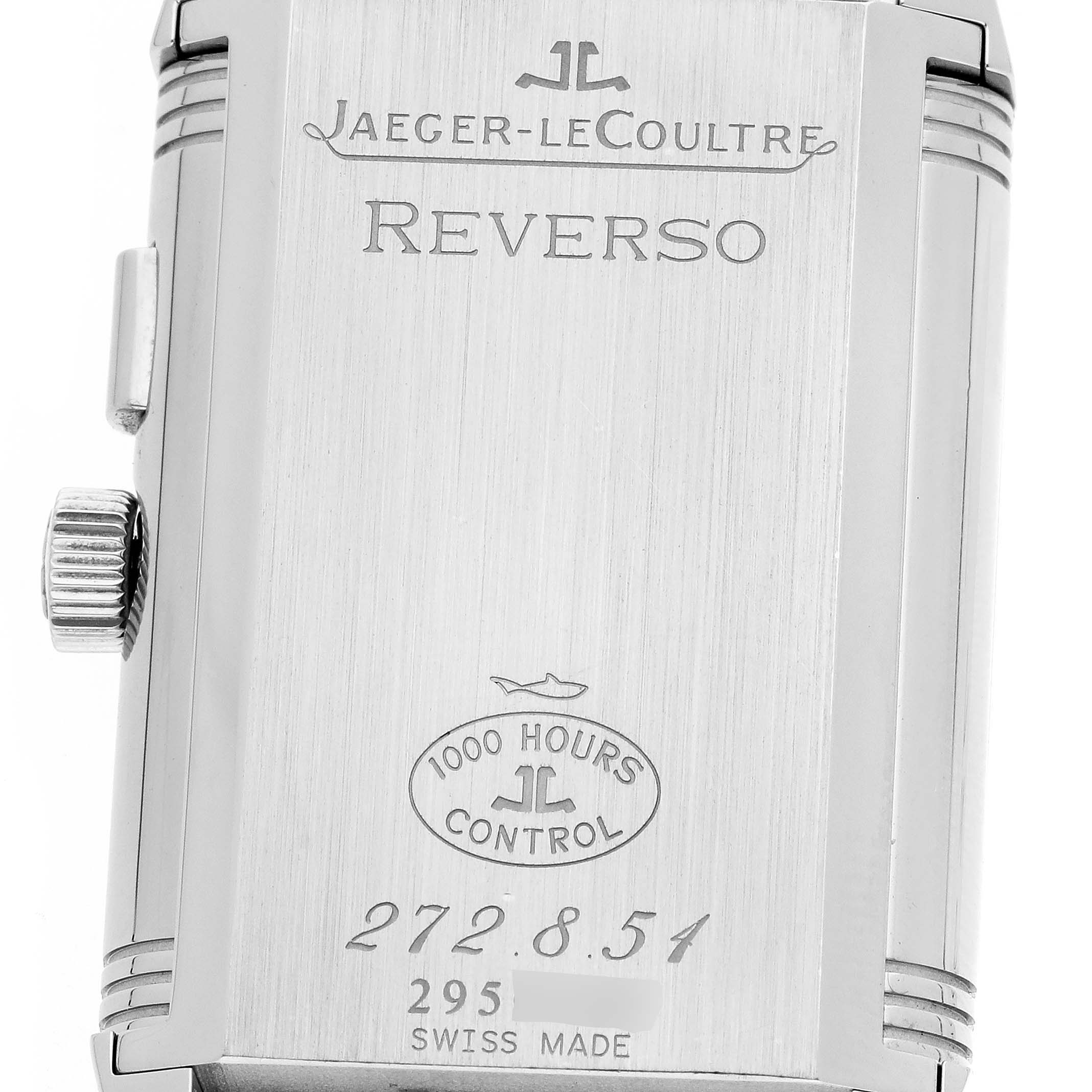 The image shows the back case of a Jaeger-LeCoultre Reverso, highlighting the brand name, model, control stamp, and serial number.