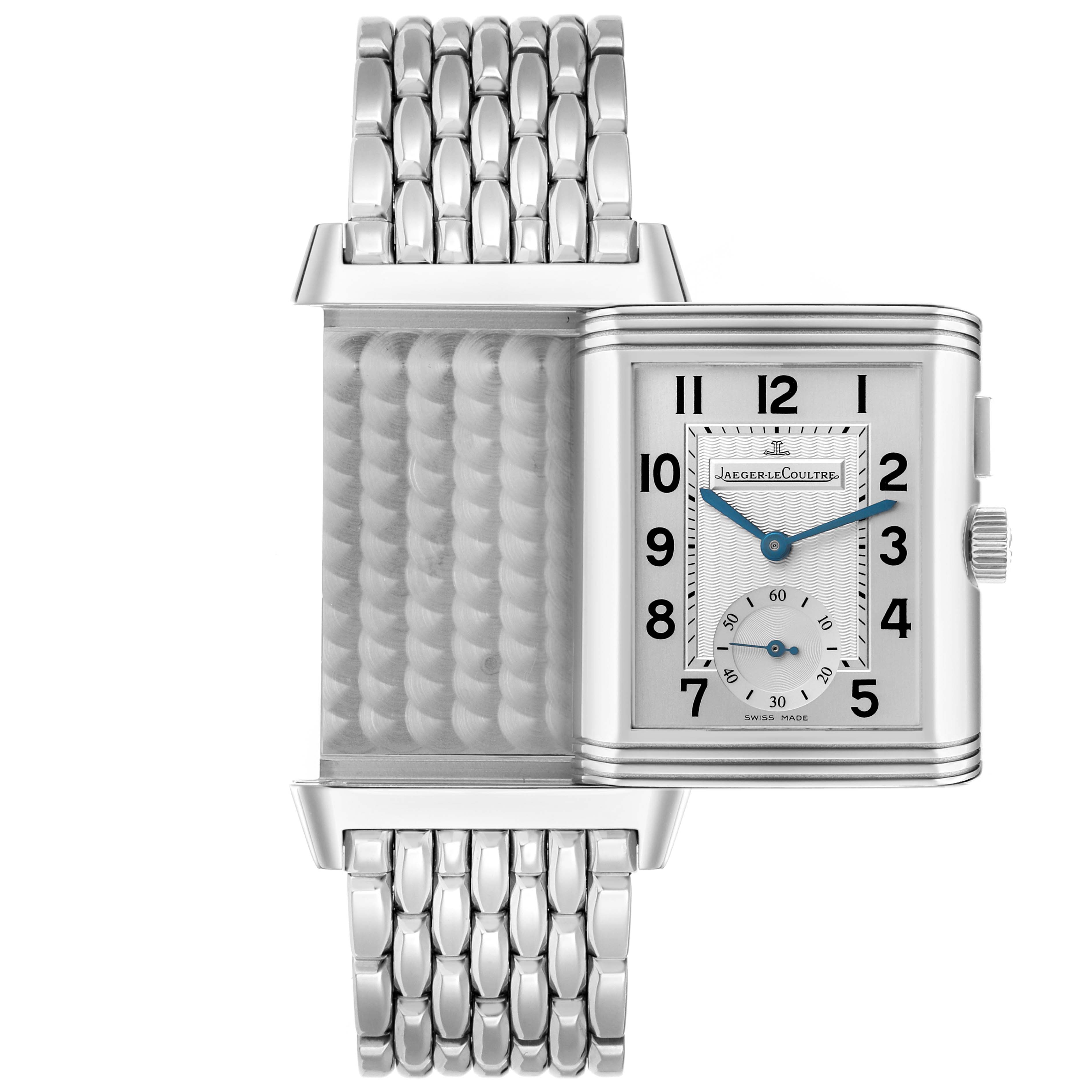 The Jaeger-LeCoultre Reverso watch is shown partly flipped to reveal the textured back and steel bracelet.
