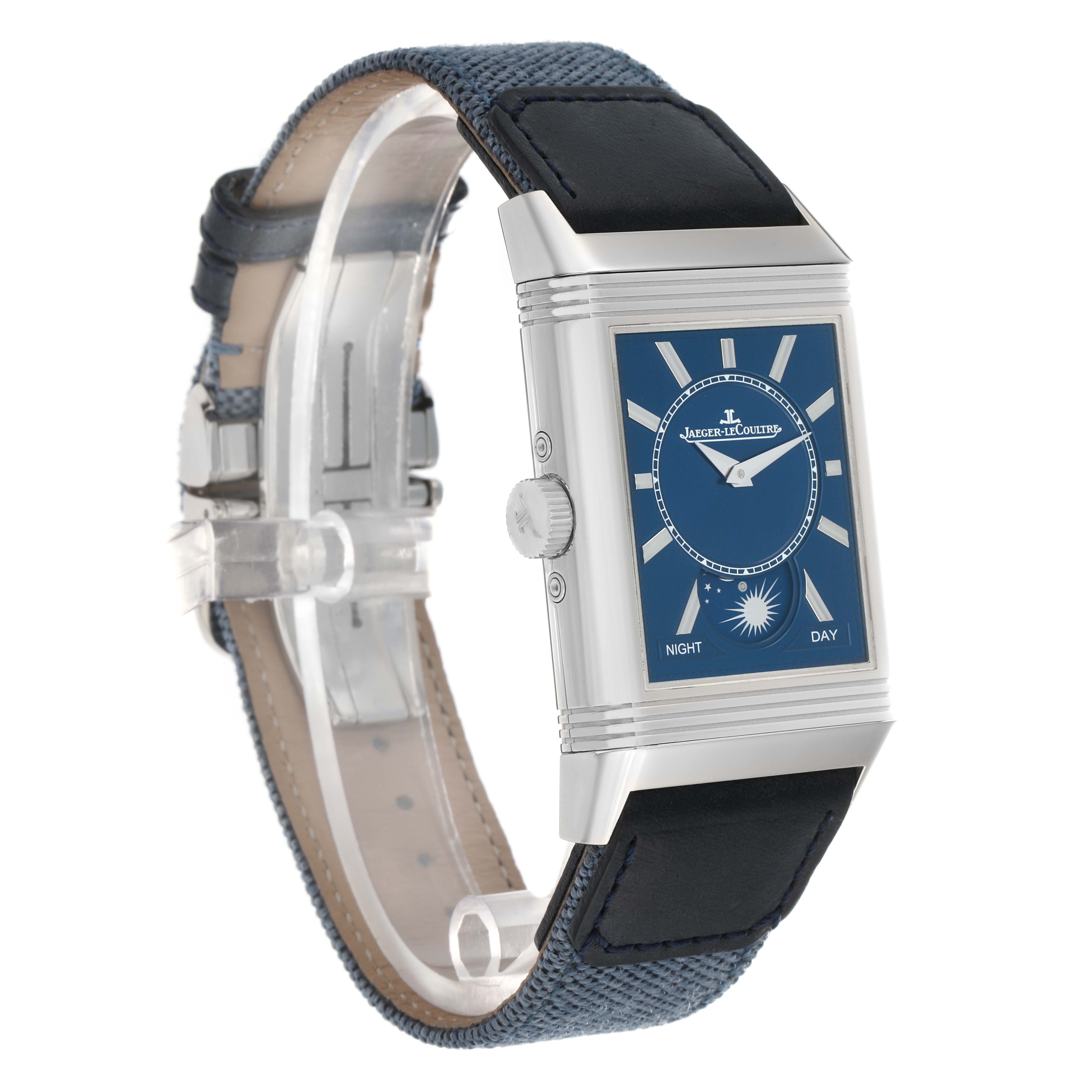 The Jaeger-LeCoultre Reverso watch is shown at a three-quarter angle, highlighting its blue dial, crown, case, and strap.