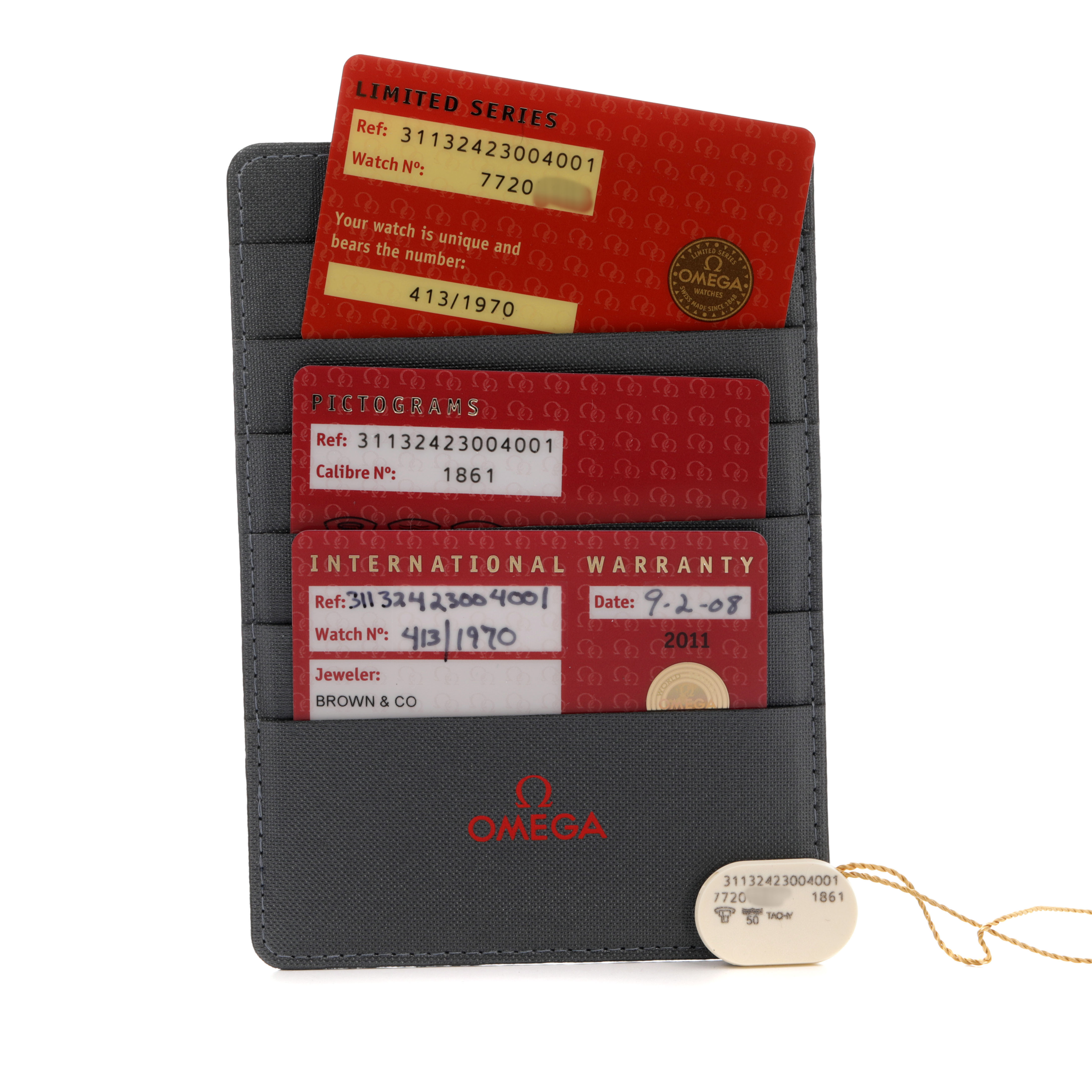 The image shows warranty cards and a tag for an Omega Speedmaster 311.32.42.30.04.001 Men's Stainless Steel White Dial, displayed in a cardholder.