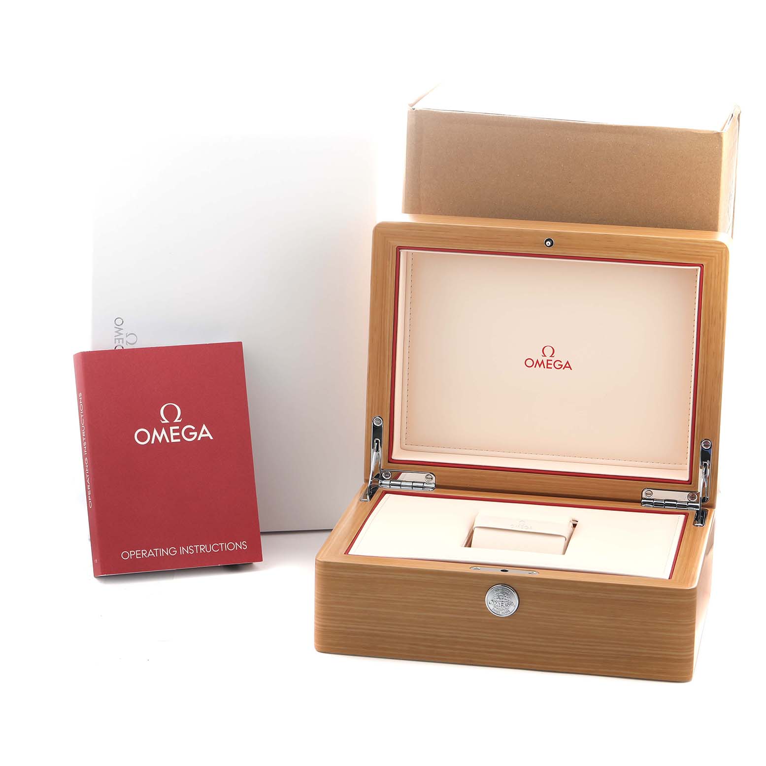 The image shows an Omega Speedmaster 311.92.44.51.01.003 Men
s Ceramic Black Dial box, open to reveal the interior, beside a red operating instructions booklet.