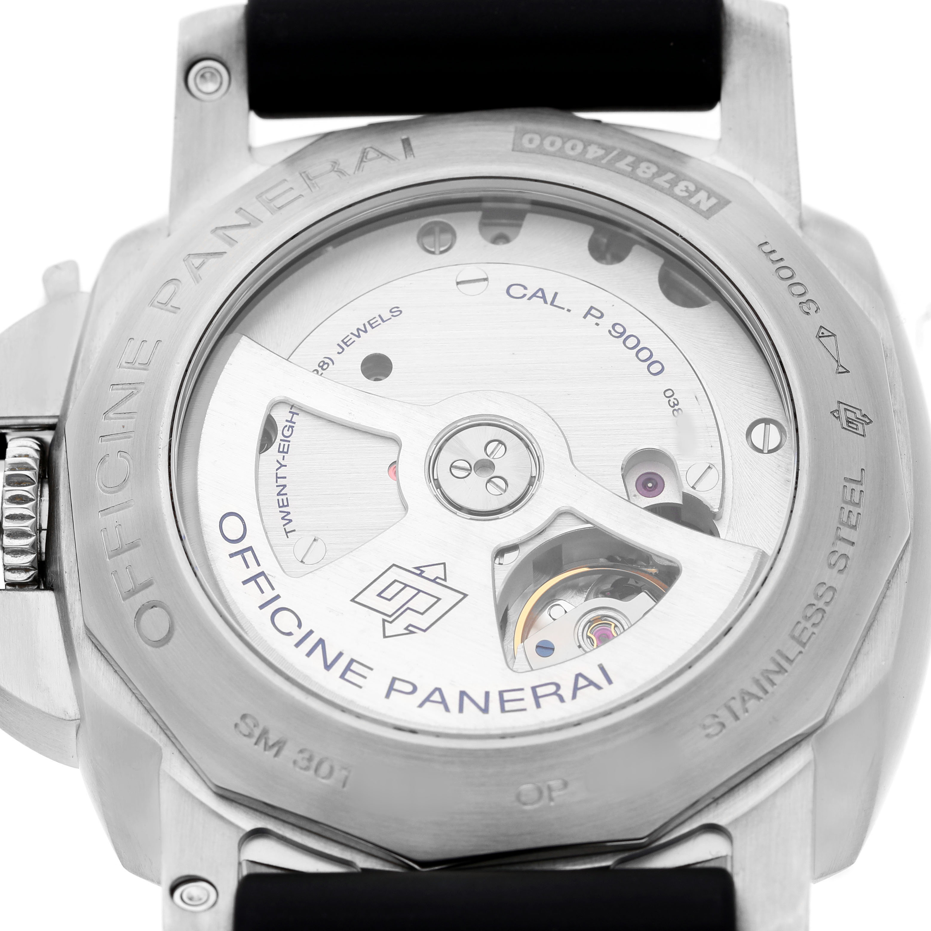 The image shows the back of a Panerai Luminor PAM00312 Men's Stainless Steel Black Dial watch, revealing the movement and engravings on the case.