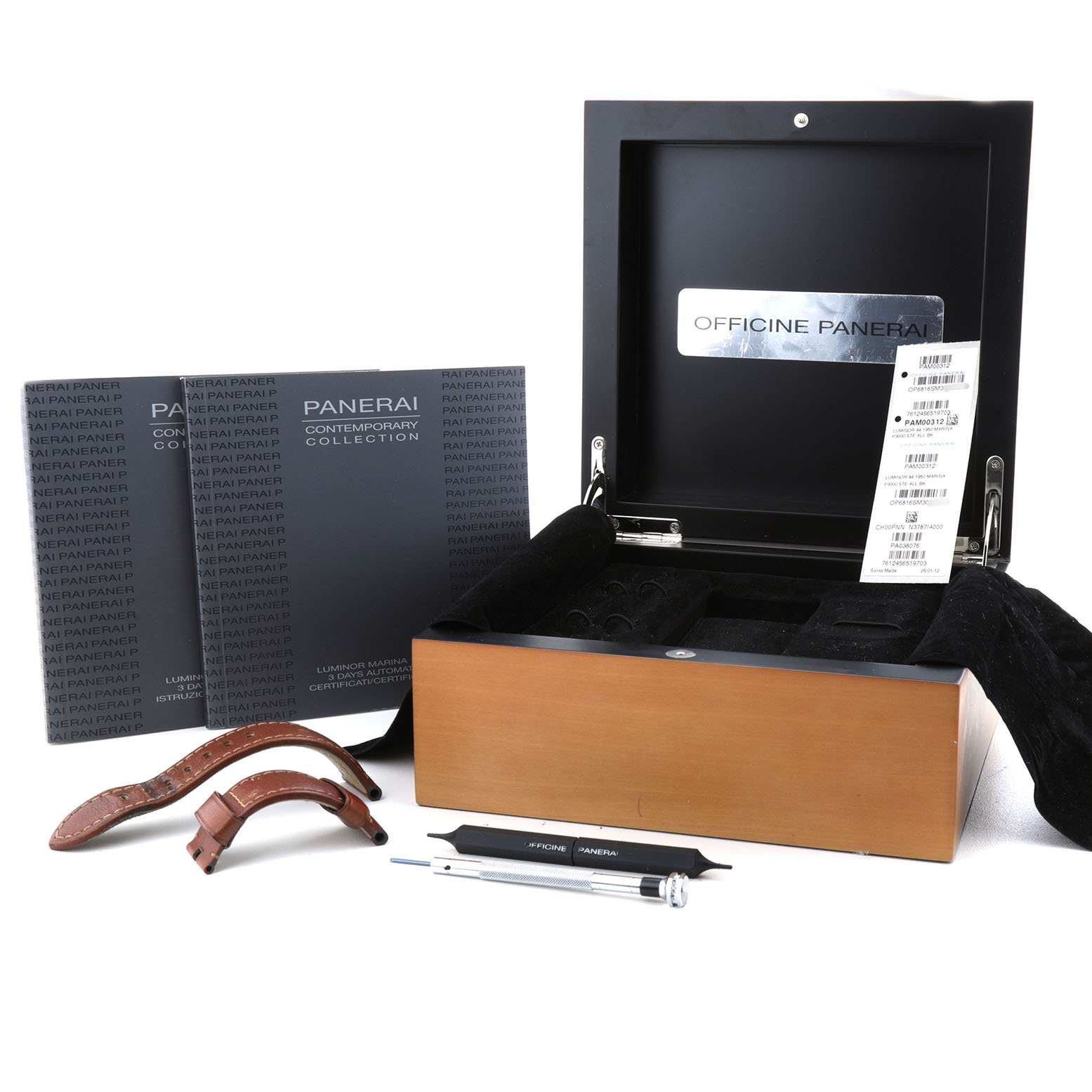 The image shows accessories for a Panerai Luminor PAM00312 Men's Stainless Steel Black Dial, including a box, straps, manuals, and a tool at a frontal angle.