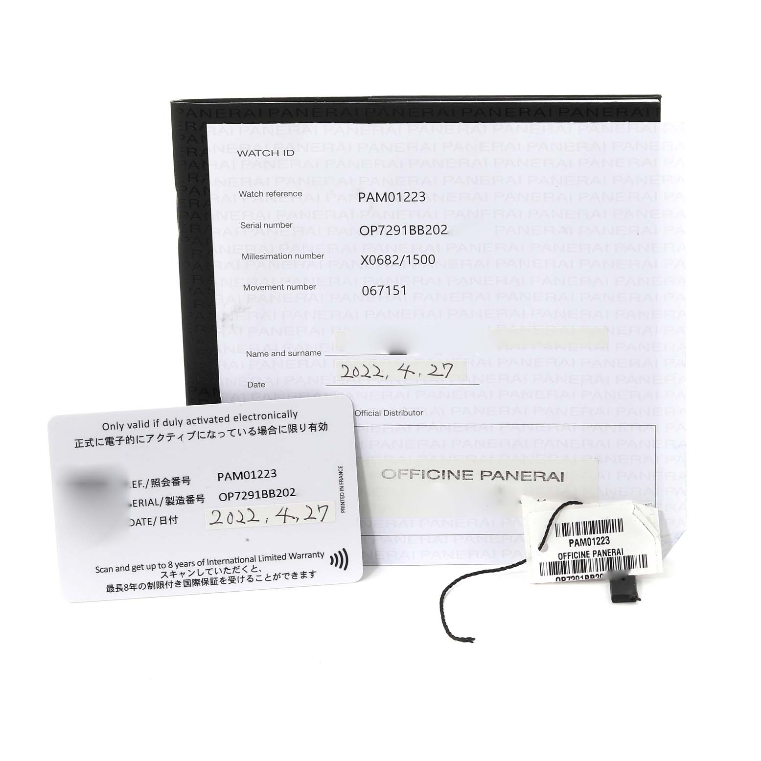 The image shows documents and tags for the Panerai Submersible PAM01223 Men
s Stainless Steel White Dial PAM01223 Men
s Stainless Steel White Dial model PAM01223 from an angled top-front view.