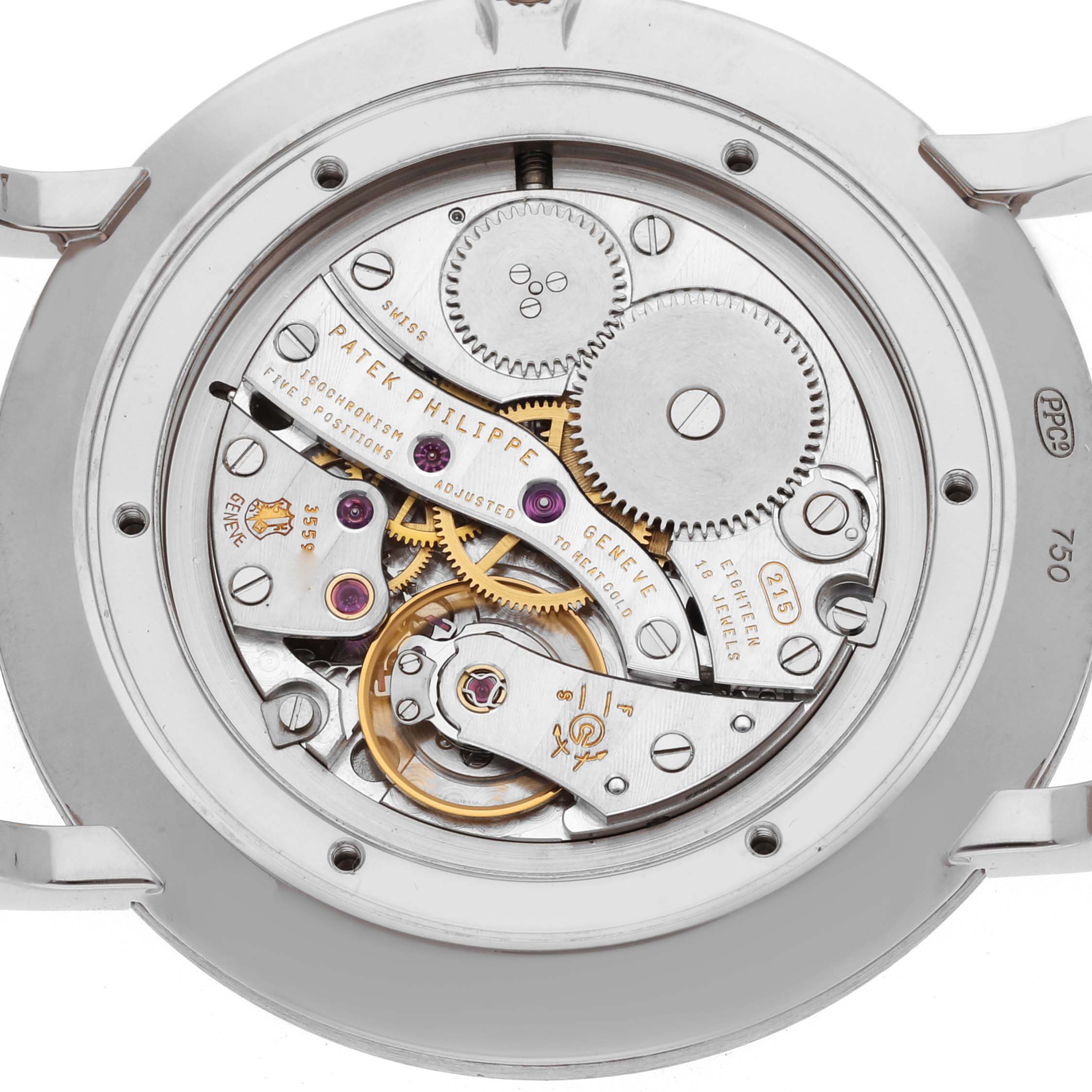 The image shows the back view of a Patek Philippe Calatrava 5119G Men
s White Gold White Dial, highlighting the intricate watch movement and gears.