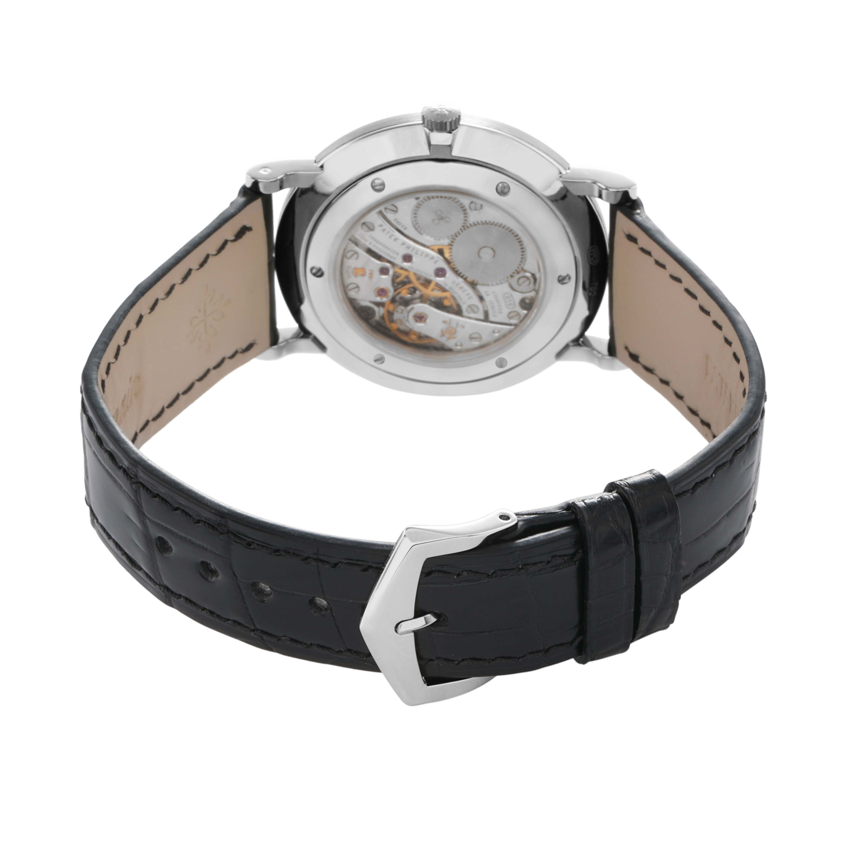 The image shows the back view of a Patek Philippe Calatrava 5119G Men
s White Gold White Dial, highlighting the movement and black leather strap with a buckle.