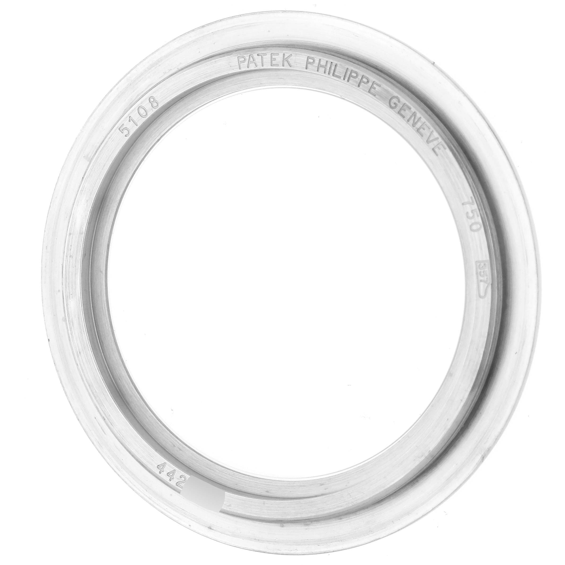 The image shows the bezel of a Patek Philippe Calatrava 5108G-012 Men
s White Gold White Dial 5108G-012 Men
s White Gold White Dial watch from a top-down angle.