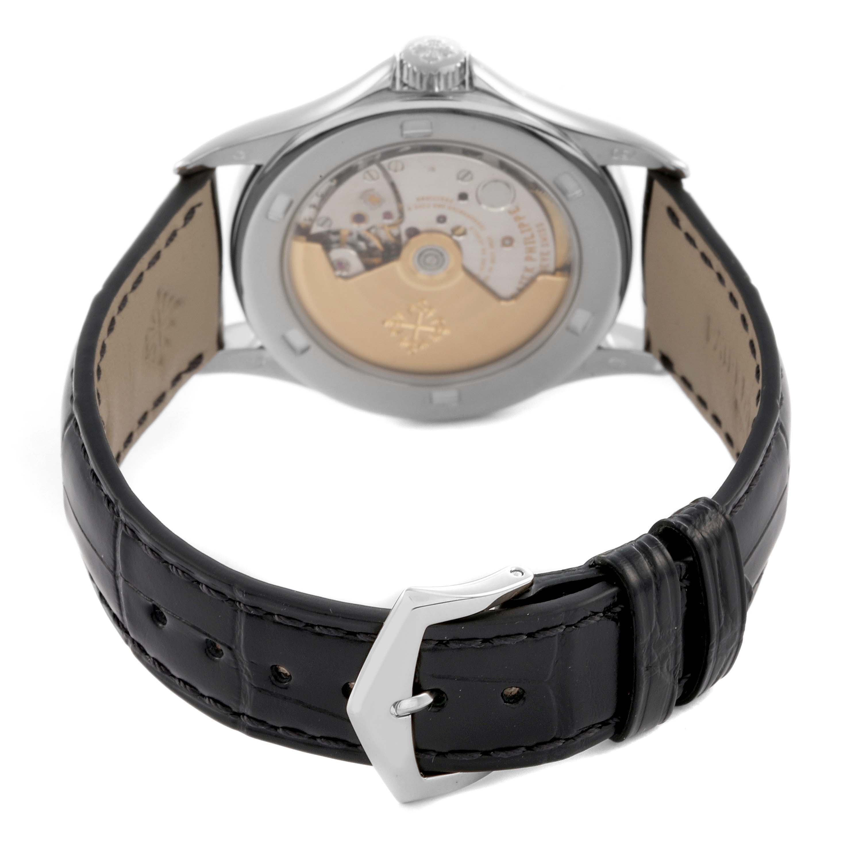 The image shows the back view of a Patek Philippe Calatrava 5108G-012 Men
s White Gold White Dial 5108G-012 Men
s White Gold White Dial, highlighting the movement and leather strap.