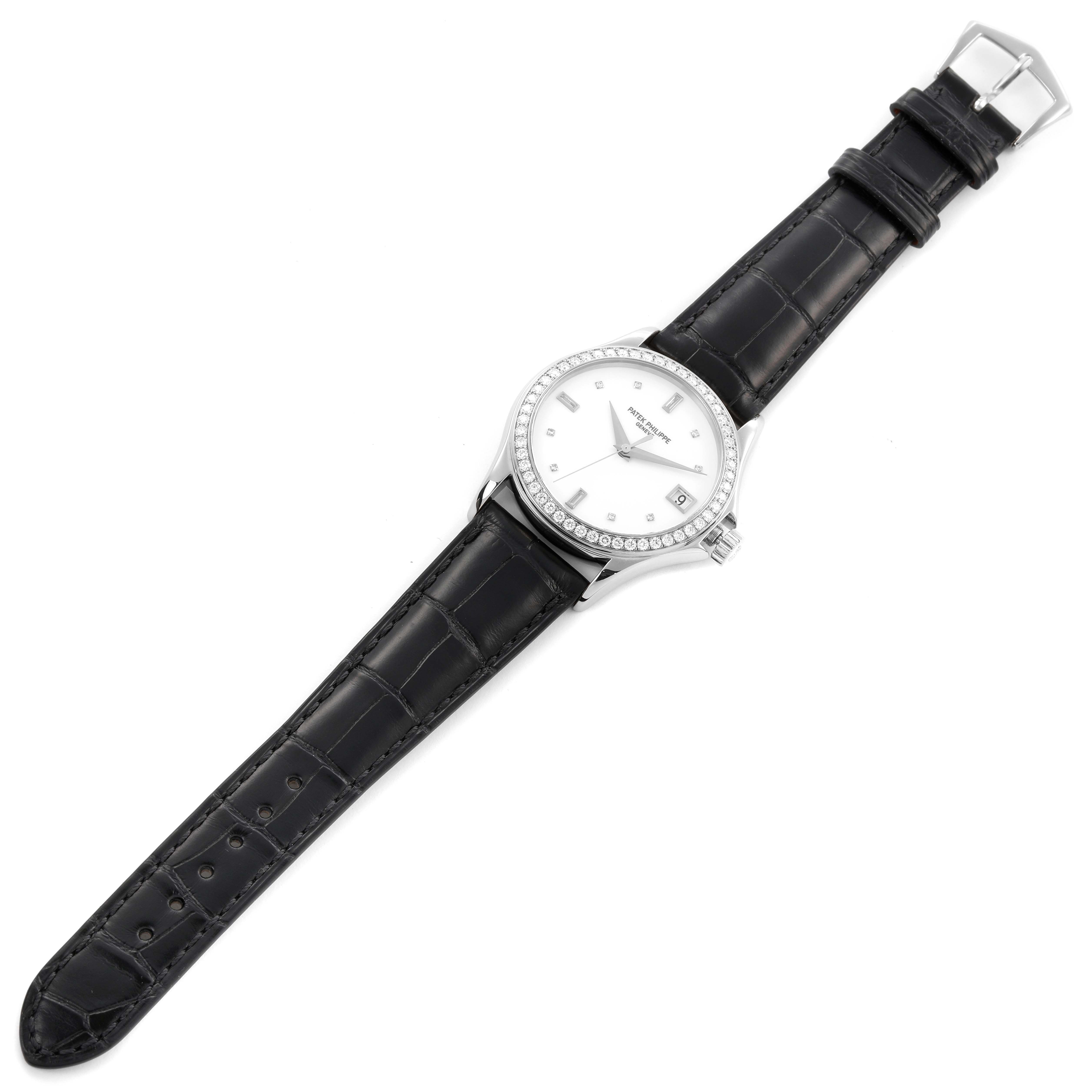 The Patek Philippe Calatrava 5108G-012 Men
s White Gold White Dial 5108G-012 Men
s White Gold White Dial watch is shown from a top-down angle, highlighting the dial, bezel, and leather strap.