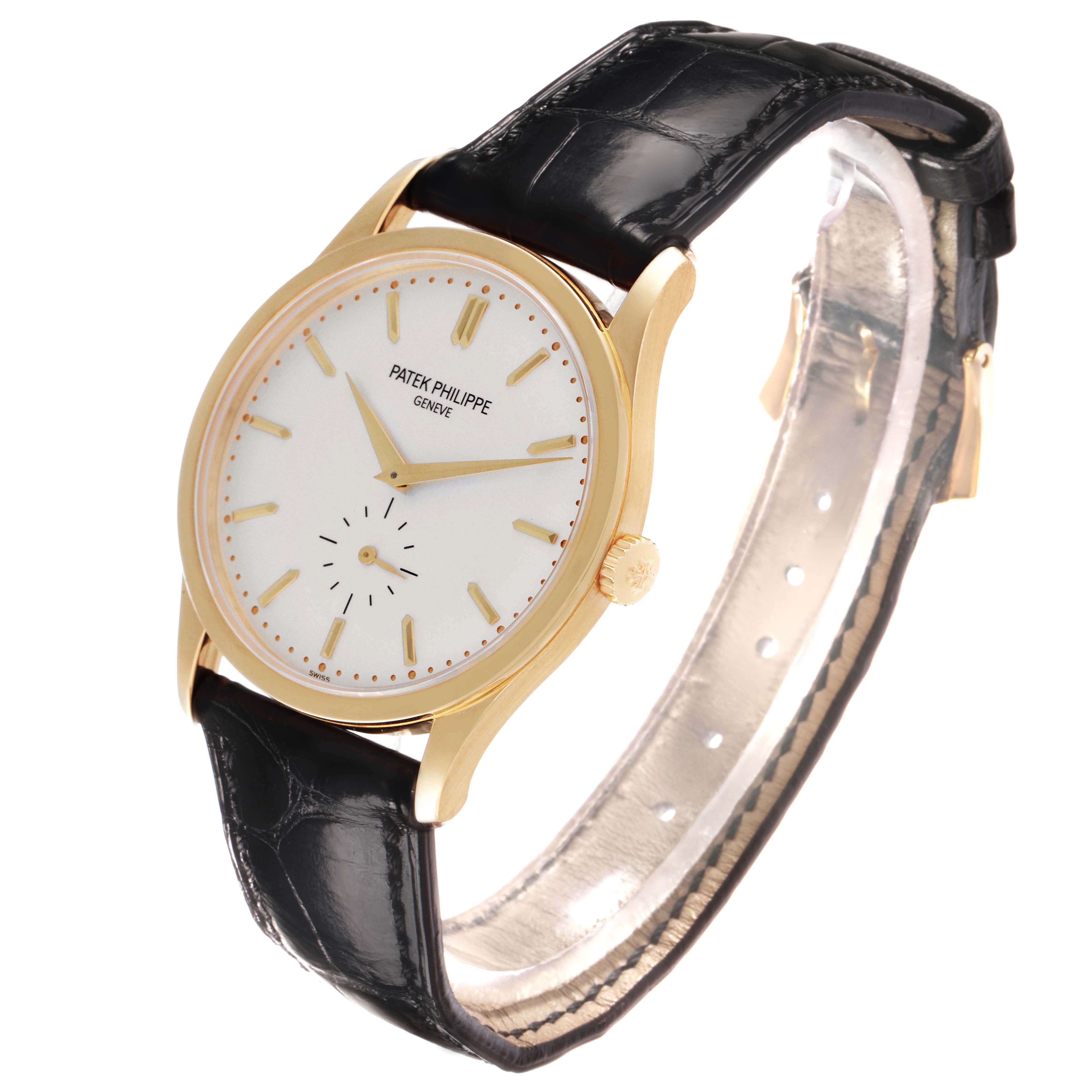 The Patek Philippe Calatrava 5196J Men's Yellow Gold Silver Dial watch is shown at a slight angle, highlighting the face, gold case, and black leather strap.