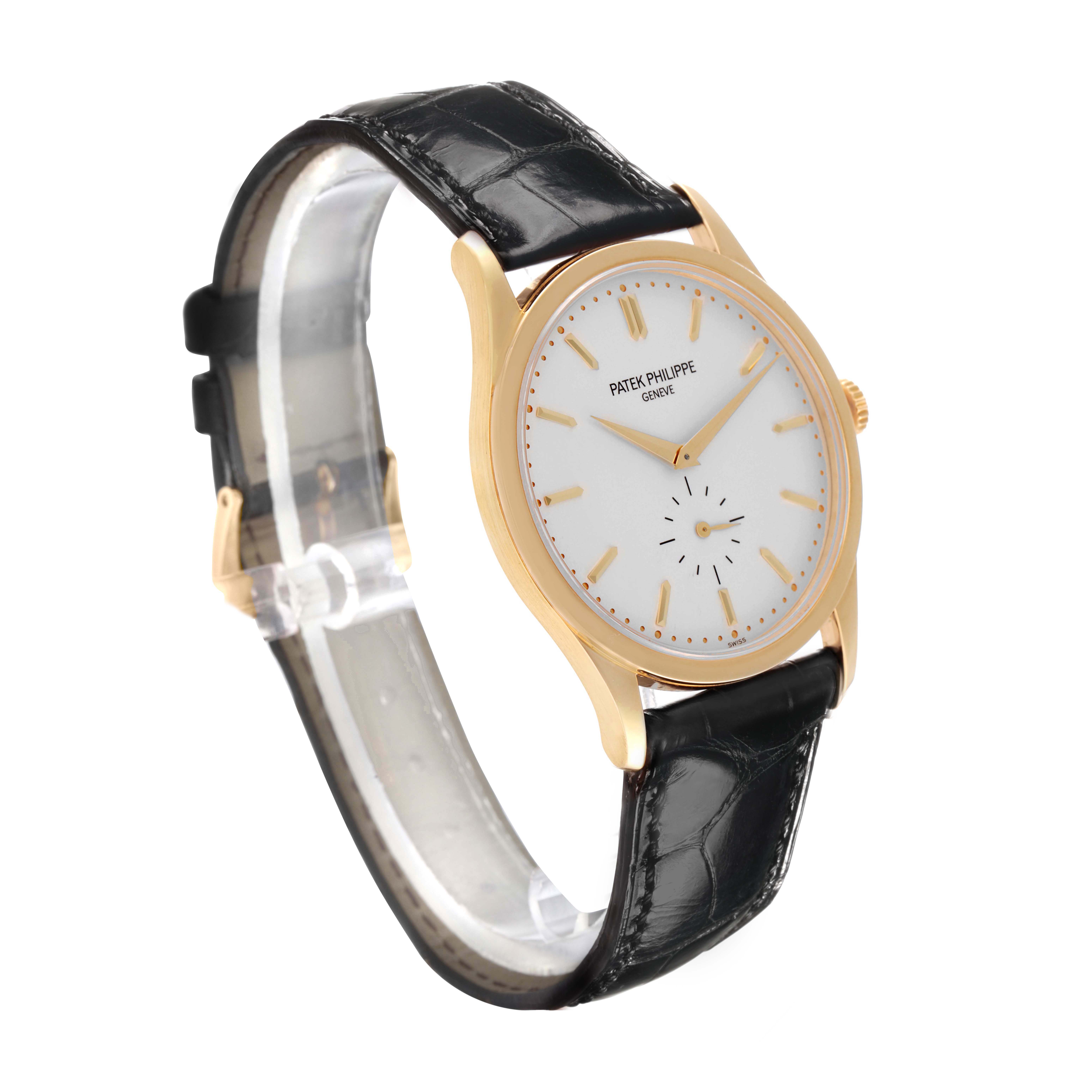 The Patek Philippe Calatrava 5196J Men's Yellow Gold Silver Dial watch is shown at a three-quarter angle, highlighting the case, dial, and leather strap.