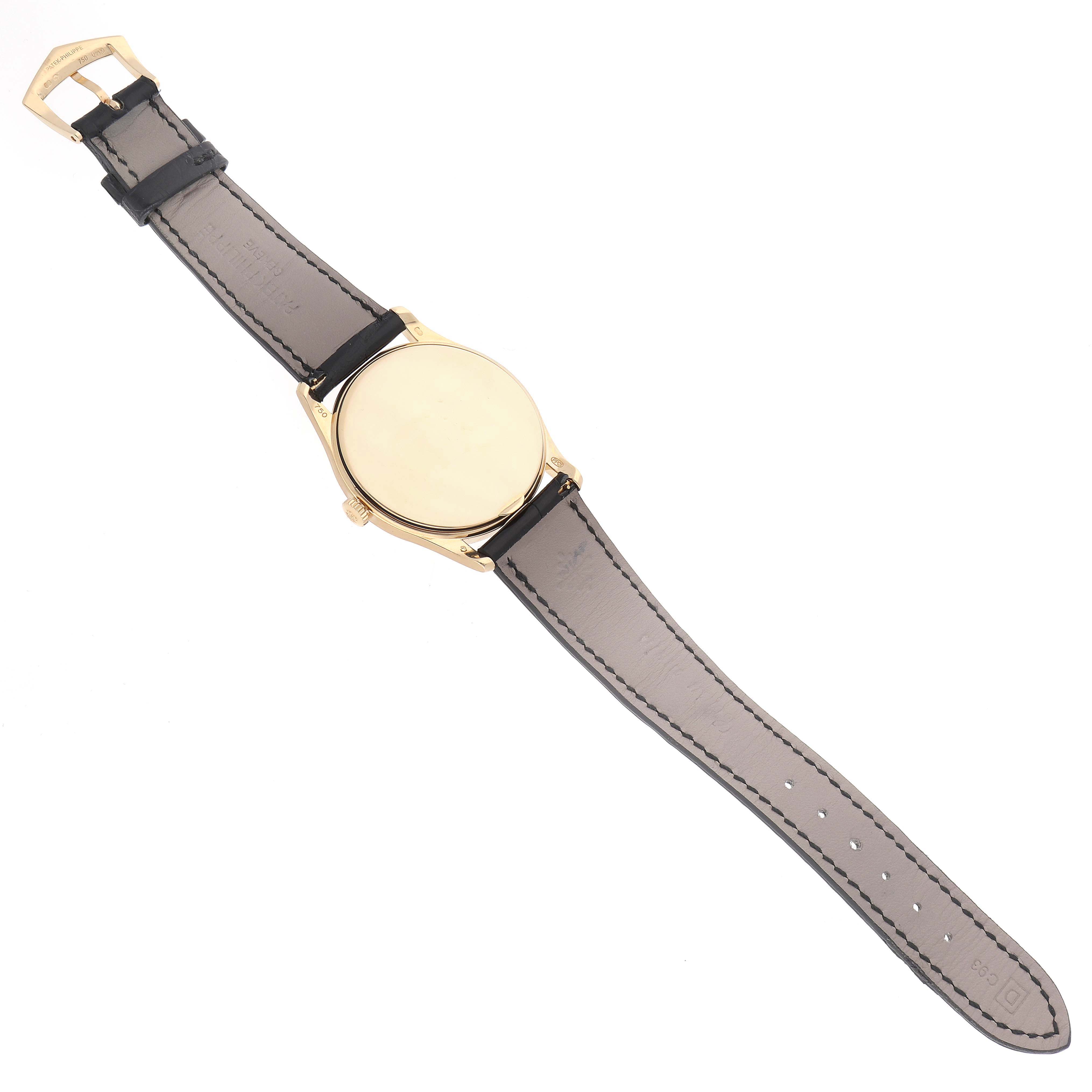 The image shows the back view of a Patek Philippe Calatrava 5196J Men's Yellow Gold Silver Dial watch, highlighting the strap and caseback.