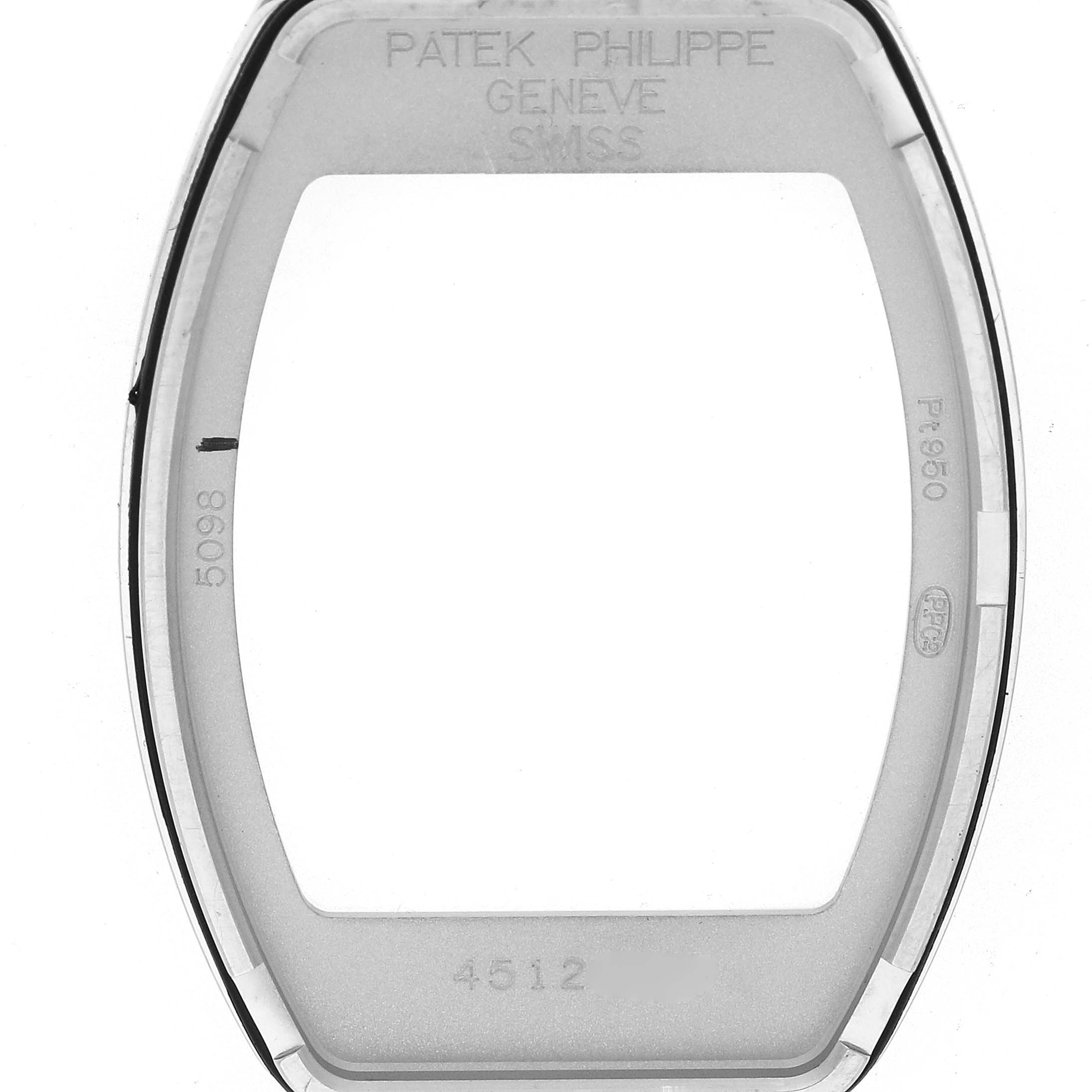 The image shows the bezel of a Patek Philippe Gondolo 5098P Men
s Platinum Silver Dial watch from a top-down angle, displaying engravings and markings.