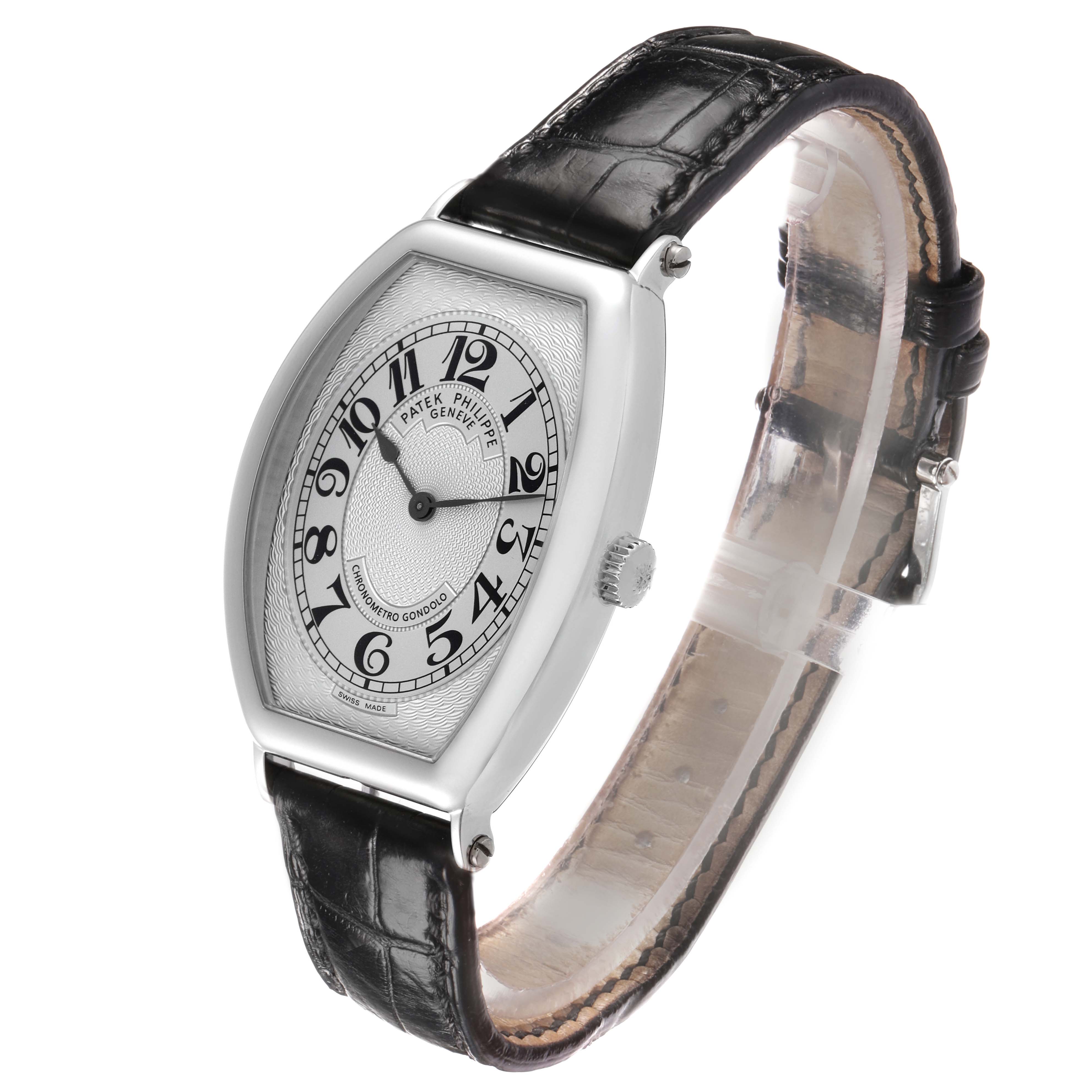 The Patek Philippe Gondolo 5098P Men
s Platinum Silver Dial watch is shown at an oblique angle, highlighting the dial, case, crown, and leather strap.