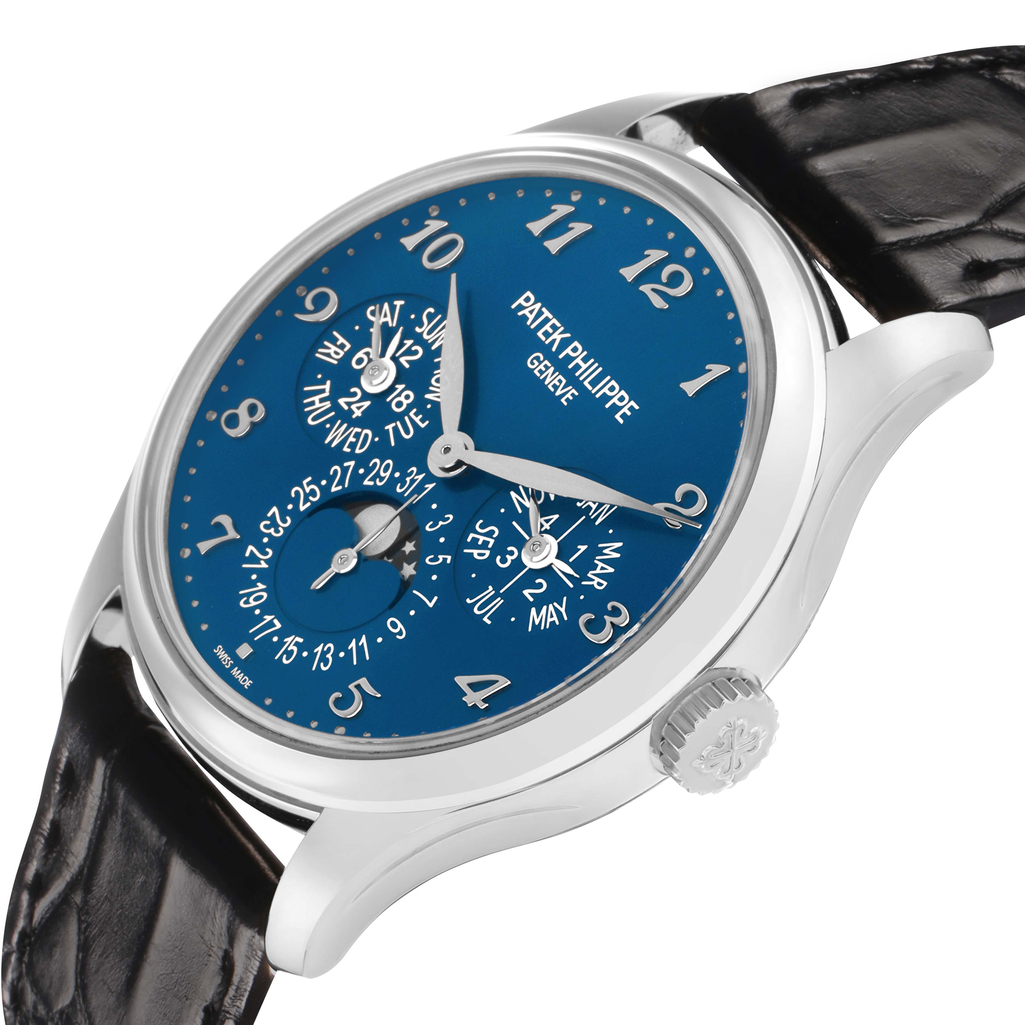 The Patek Philippe Complications 5327G Men
s White Gold Blue Dial watch is shown from a side angle, highlighting the blue dial, lugs, and crown with intricate numerals and subdials.
