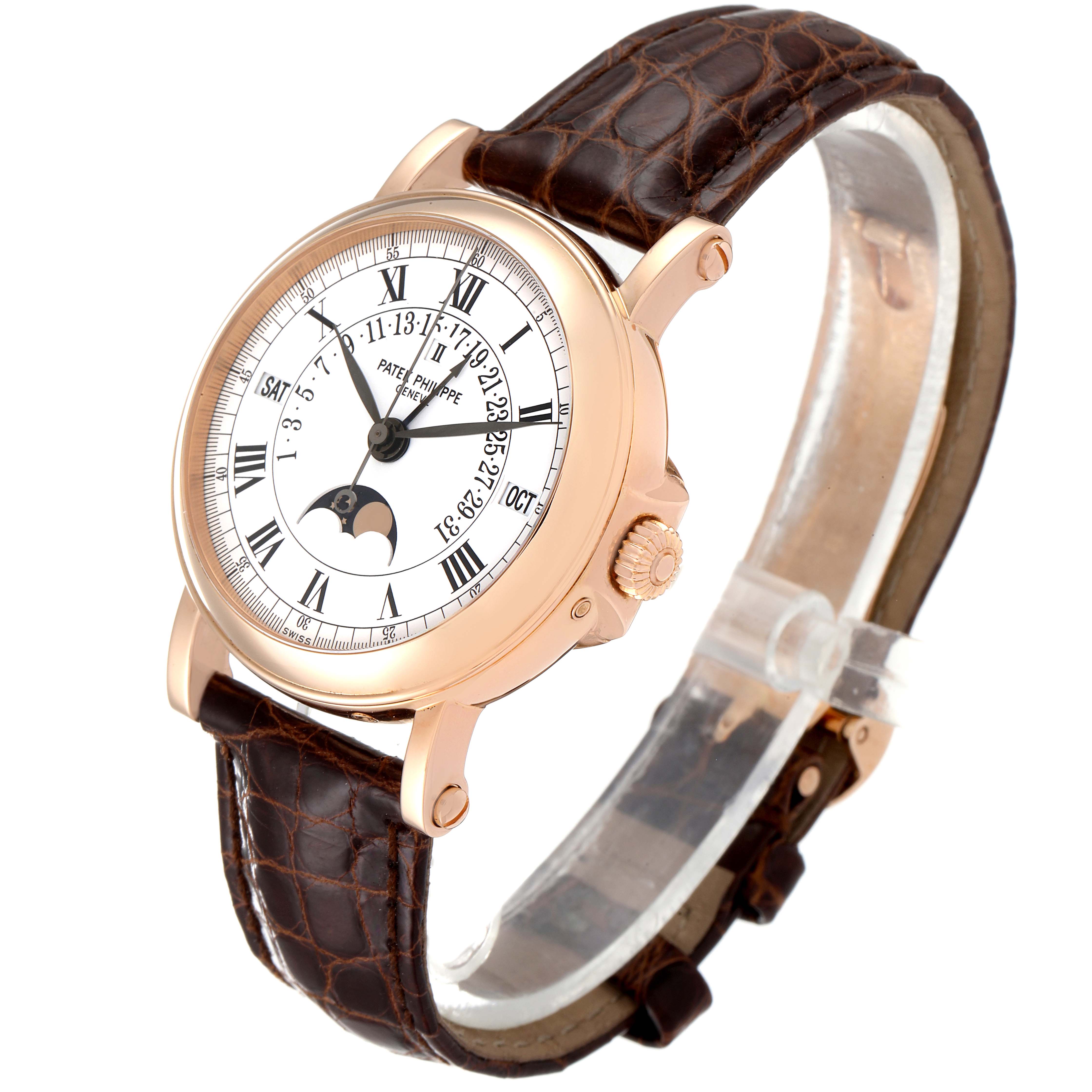 The Patek Philippe Complications 5059R Men
s Rose Gold White Dial 5059R Men
s Rose Gold White Dial watch is shown at an angled side view, featuring the dial, crown, and leather strap.