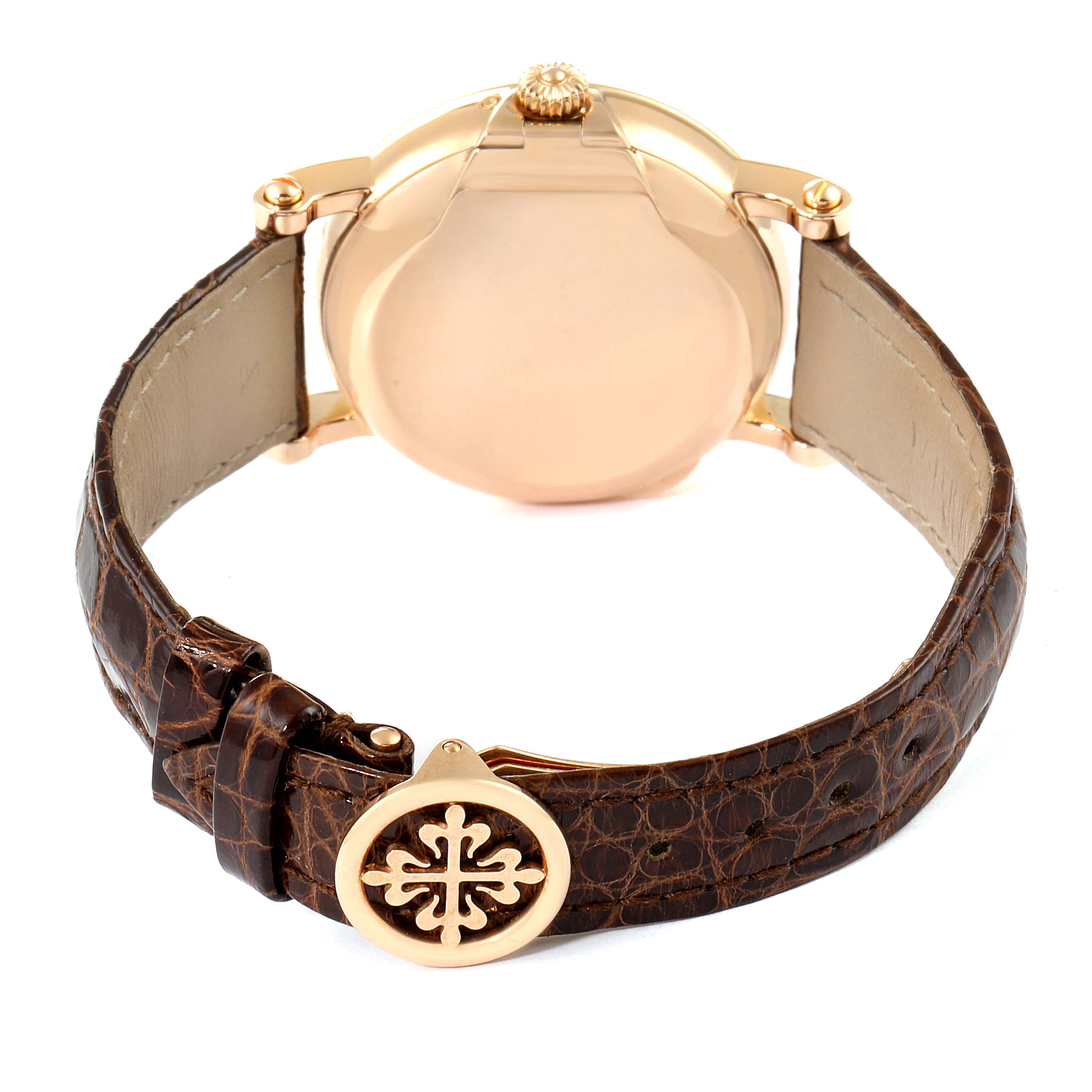 The image shows the back view of a Patek Philippe Complications 5059R Men
s Rose Gold White Dial 5059R Men
s Rose Gold White Dial watch, highlighting its leather strap and clasp.