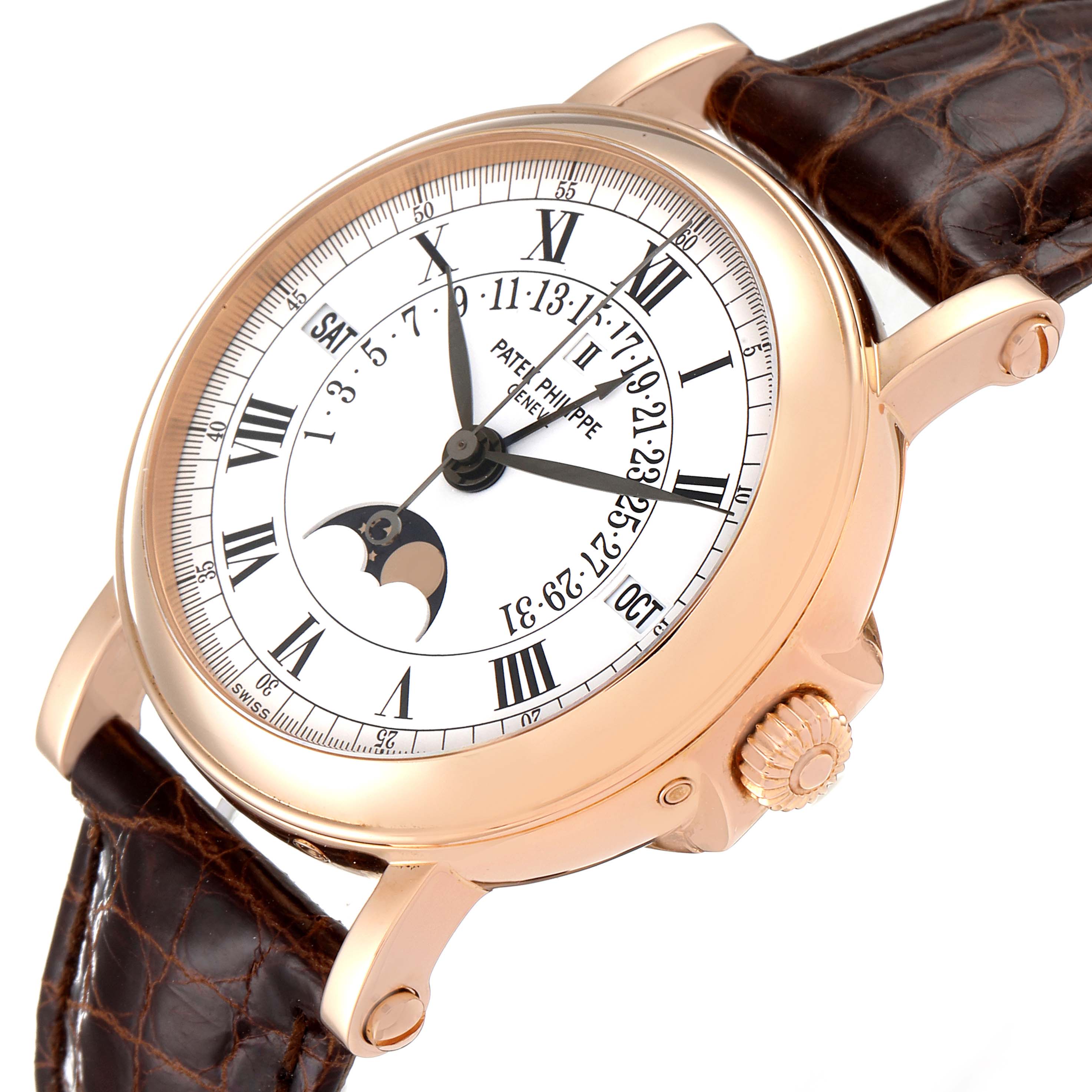 The image shows a Patek Philippe Complications 5059R Men
s Rose Gold White Dial 5059R Men
s Rose Gold White Dial model watch at an angle highlighting the dial, crown, and brown leather strap.