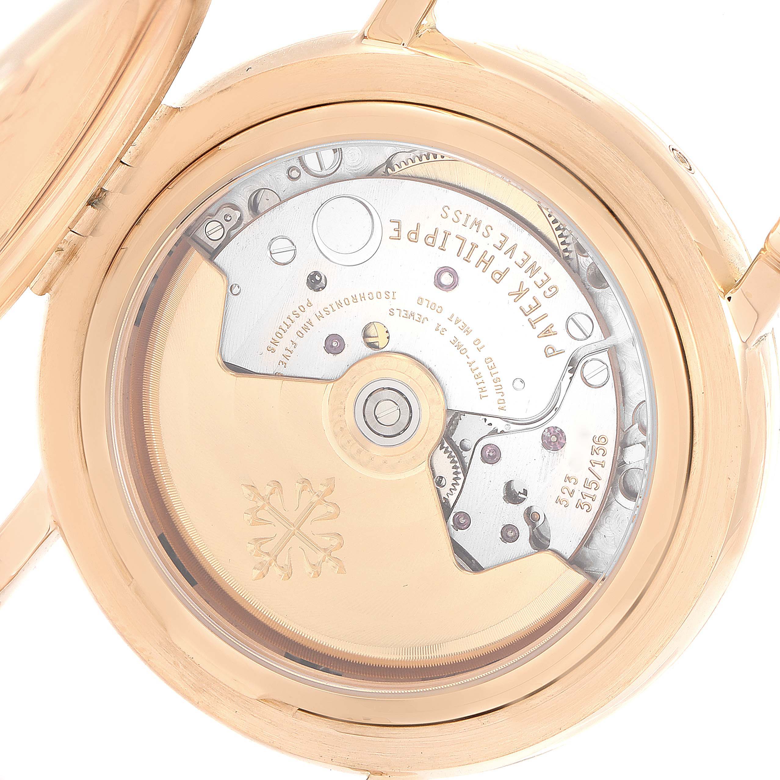 This image shows the open back of the Patek Philippe Complications 5059R Men
s Rose Gold White Dial 5059R Men
s Rose Gold White Dial watch, revealing its mechanical movement and inner workings.