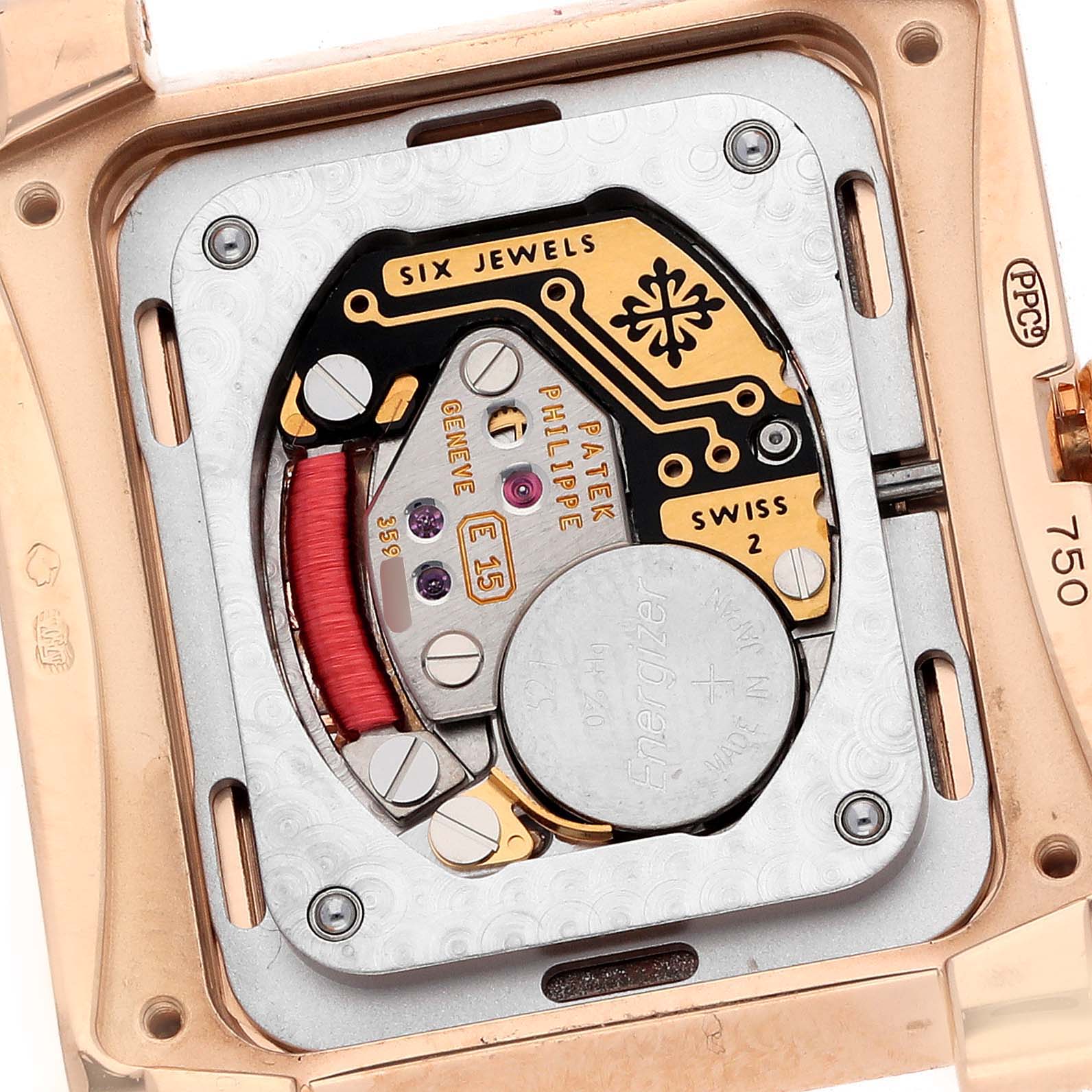 The image shows the movement and internal mechanism of the Patek Philippe Twenty-4 4910R Women
s Rose Gold Silver Dial watch from the back.