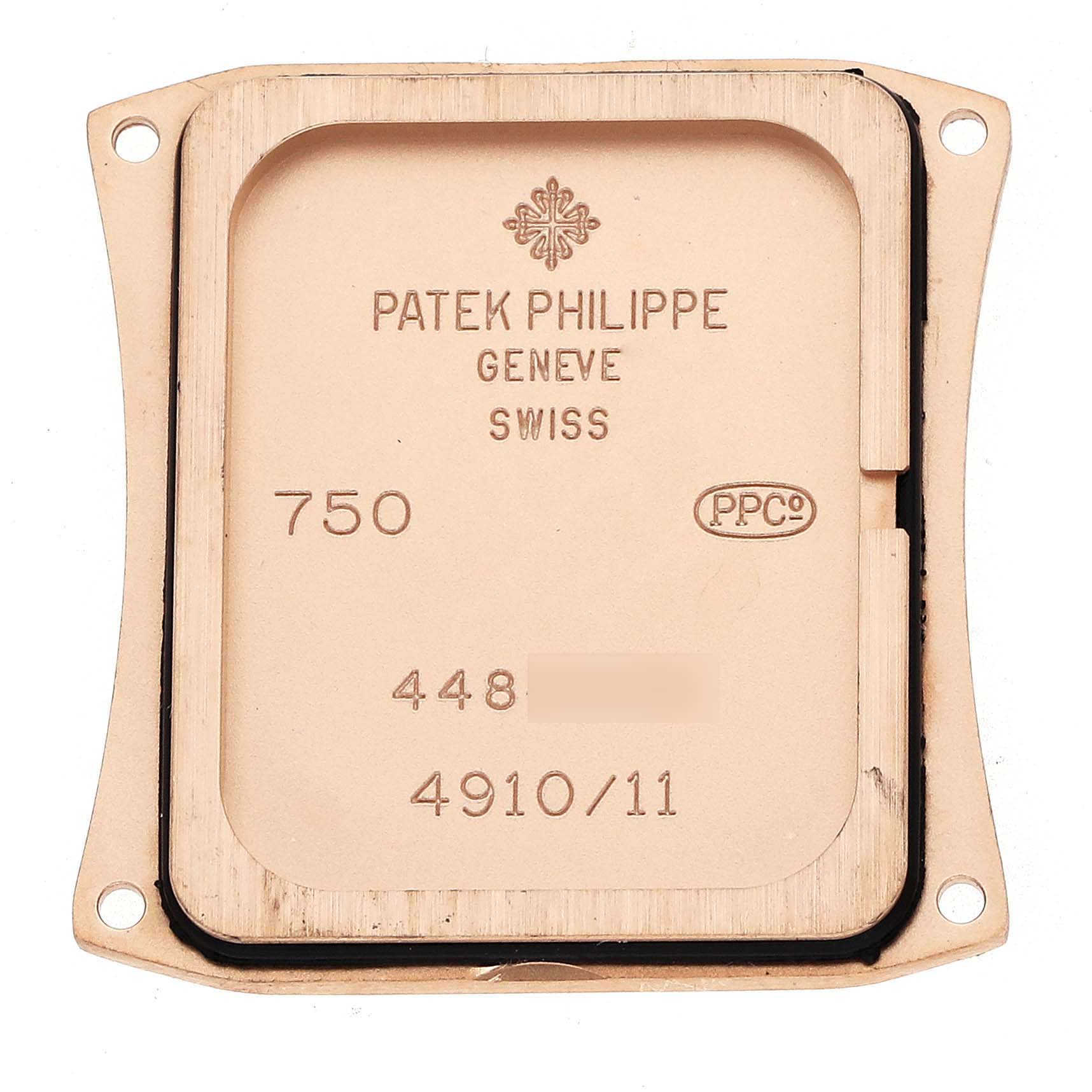 The image shows the back case of a Patek Philippe Twenty-4 4910R Women
s Rose Gold Silver Dial watch, highlighting engraved details.