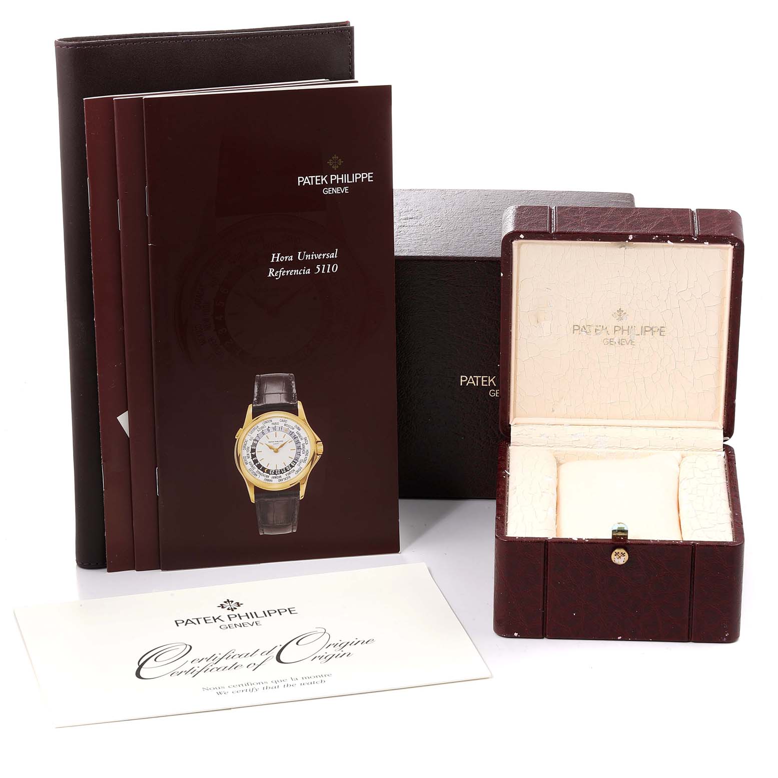 The image shows the packaging, manual, certificate, and an open watch box for the Patek Philippe Complications 5110J Men's Yellow Gold Silver Dial 5110J Men's Yellow Gold Silver Dial model.