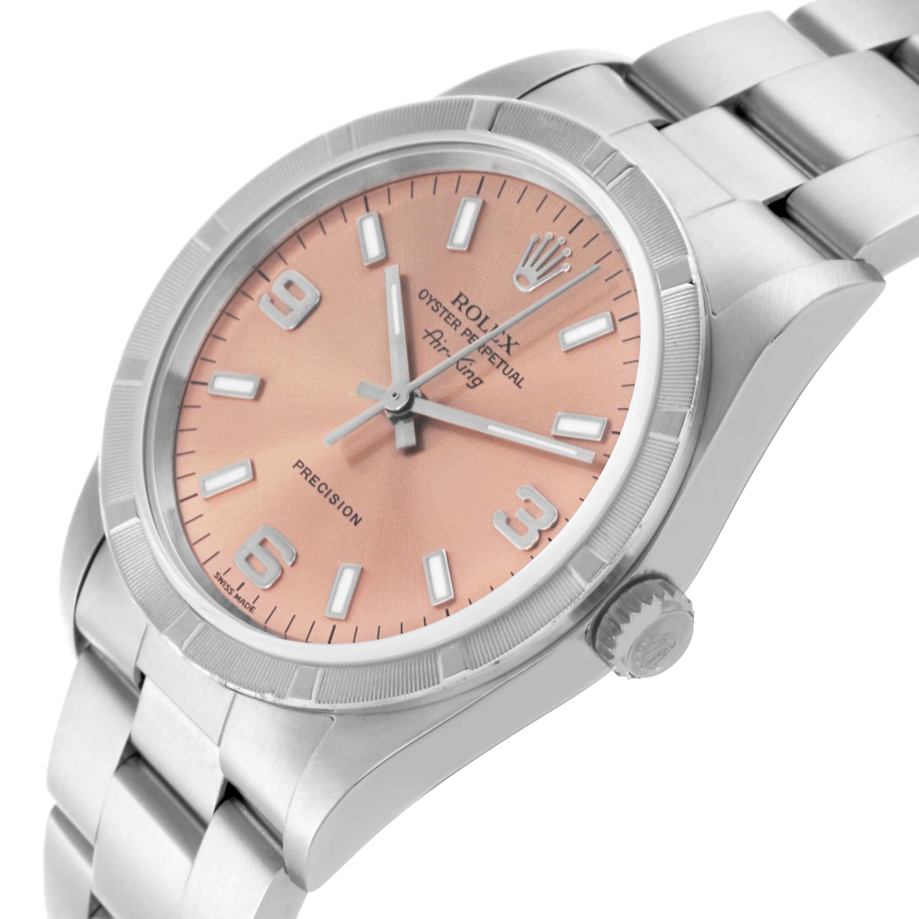 The Rolex Air-King 14010M Men's Stainless Steel Pink Dial 14010M Men's Stainless Steel Pink Dial watch is shown at a slight angled side view, highlighting the dial, bezel, and bracelet.