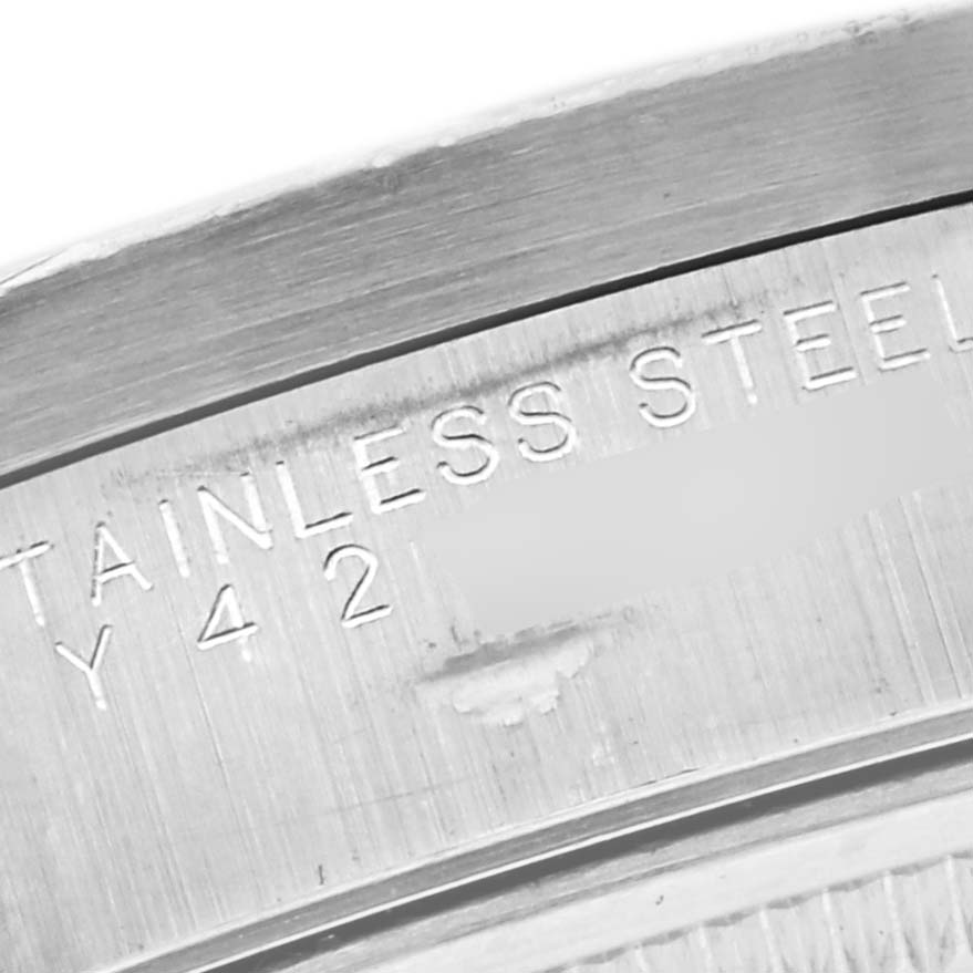 The image shows a close-up of the engraved details on the caseback of a Rolex Air-King 14010M Men's Stainless Steel Pink Dial 14010M Men's Stainless Steel Pink Dial watch.