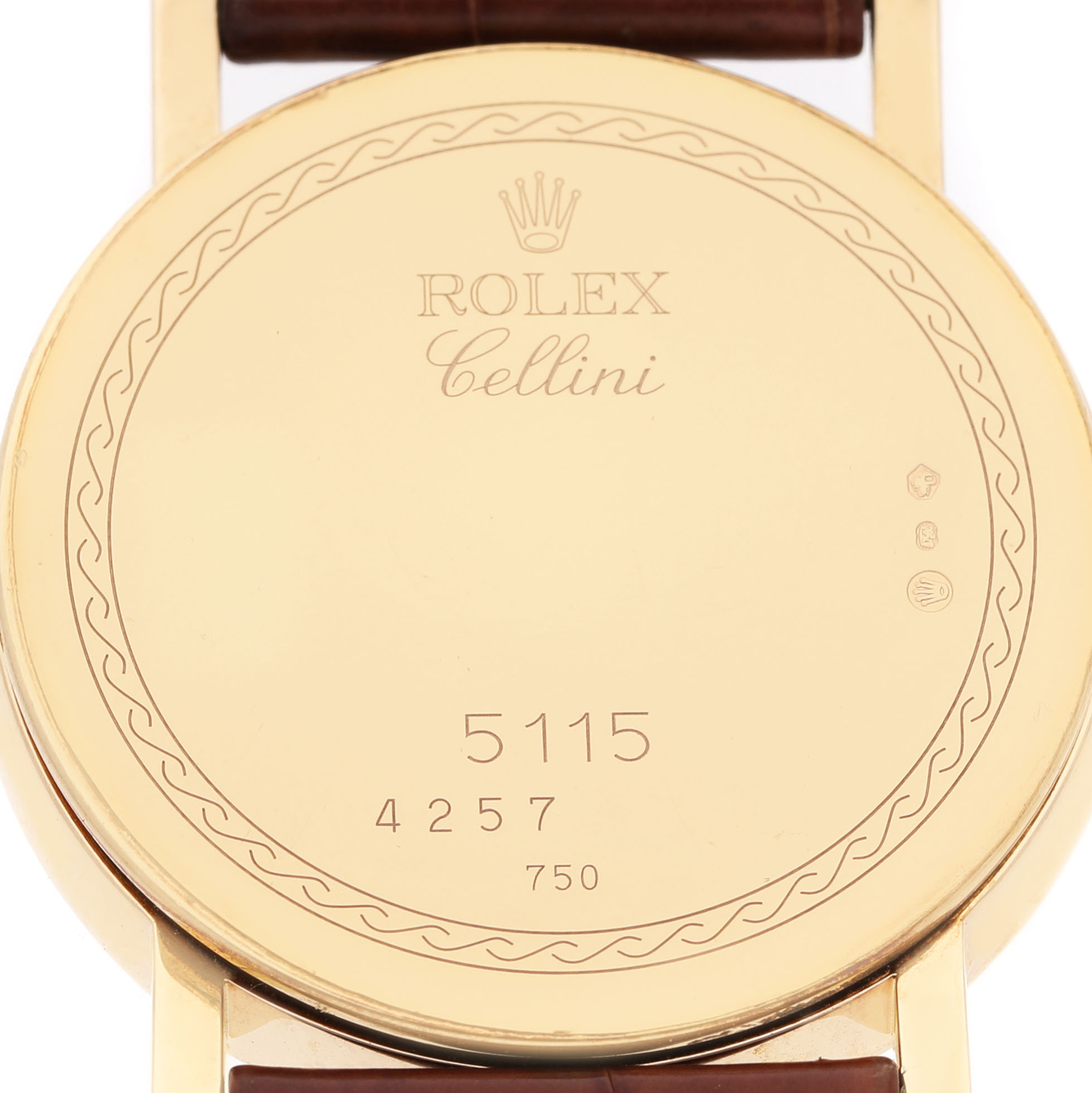 The image shows the back case of a Rolex Cellini 5115/8 Men's Yellow Gold Mother of Pearl Dial watch, with engraved details and part of the strap visible.