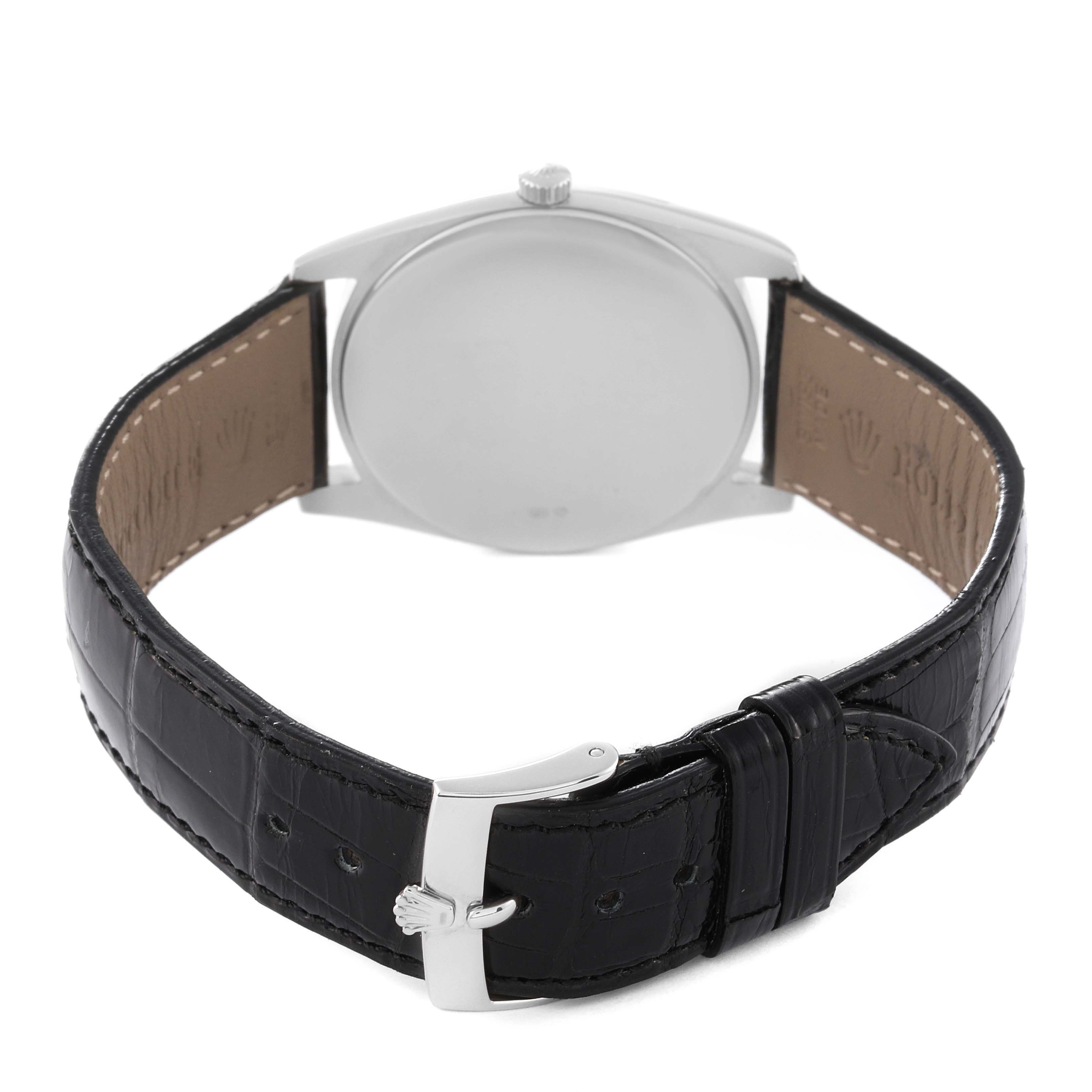 The image shows the rear view of a Rolex Cellini 4233/9 Men's White Gold White Dial 4233/9 Men's White Gold White Dial watch, featuring its black leather strap and buckle.