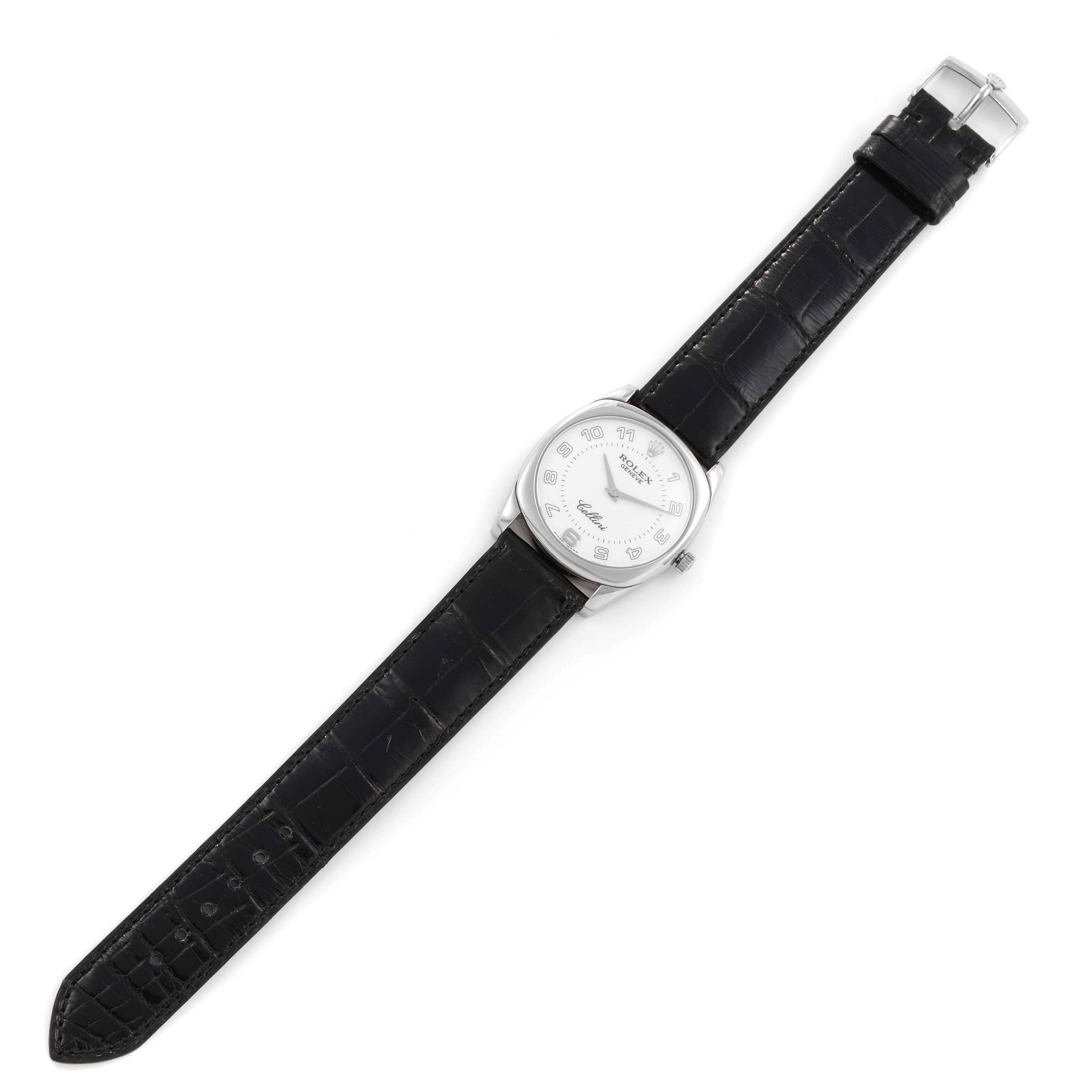 The Rolex Cellini 4233/9 Men's White Gold White Dial 4233/9 Men's White Gold White Dial watch is shown from a top-down angle, displaying its face, dial, and full black leather strap.