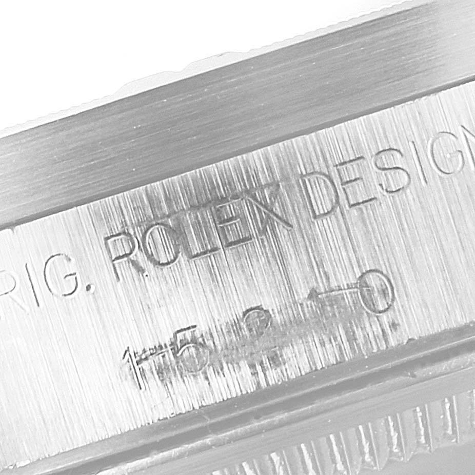 This close-up image shows the side engraving on the case of the Rolex Date 15210 Men's Stainless Steel Blue Dial 15210 Men's Stainless Steel Blue Dial model.