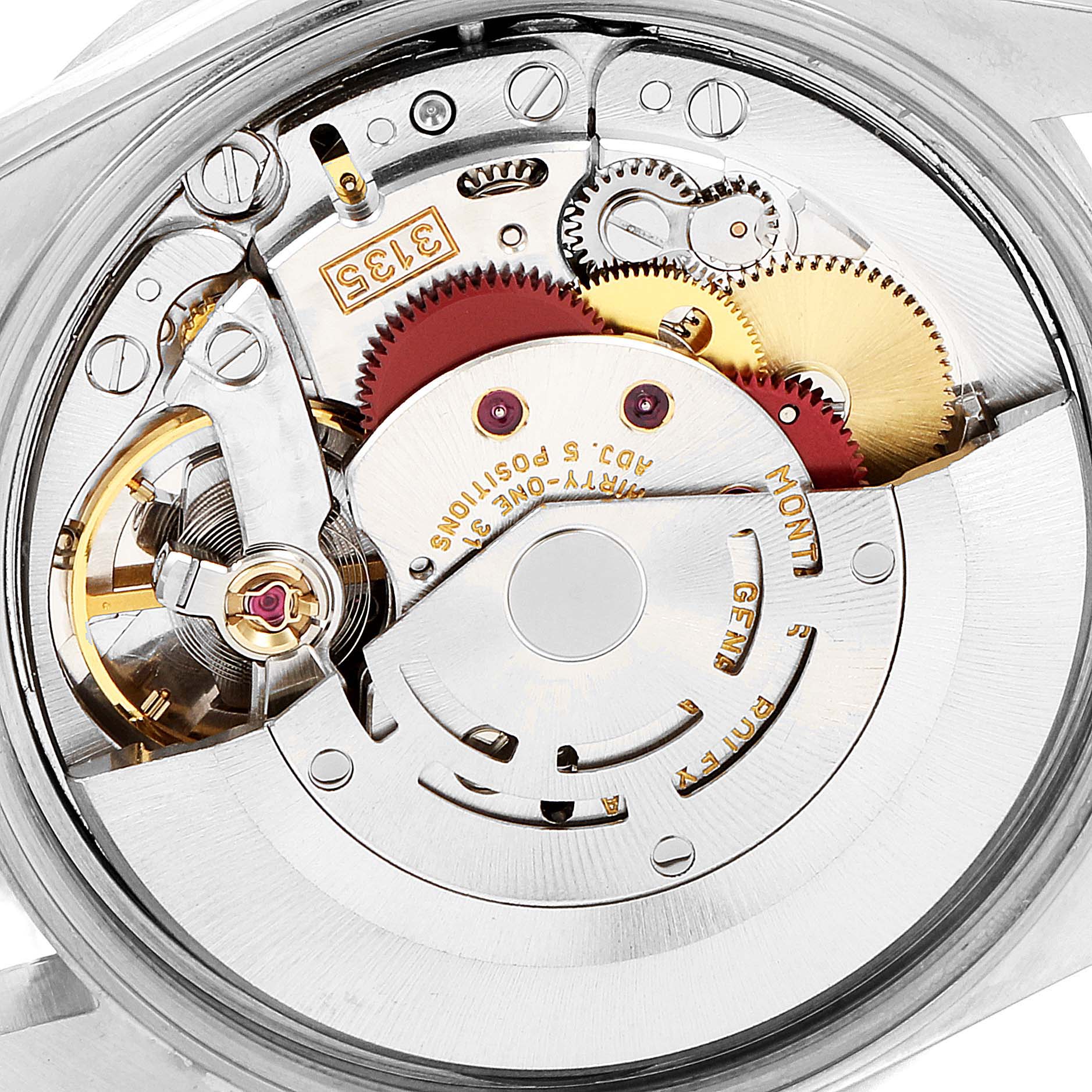 This image shows the intricate movement mechanism of a Rolex Date 15210 Men's Stainless Steel Blue Dial 15210 Men's Stainless Steel Blue Dial model watch from a top-down angle with visible gears and components.