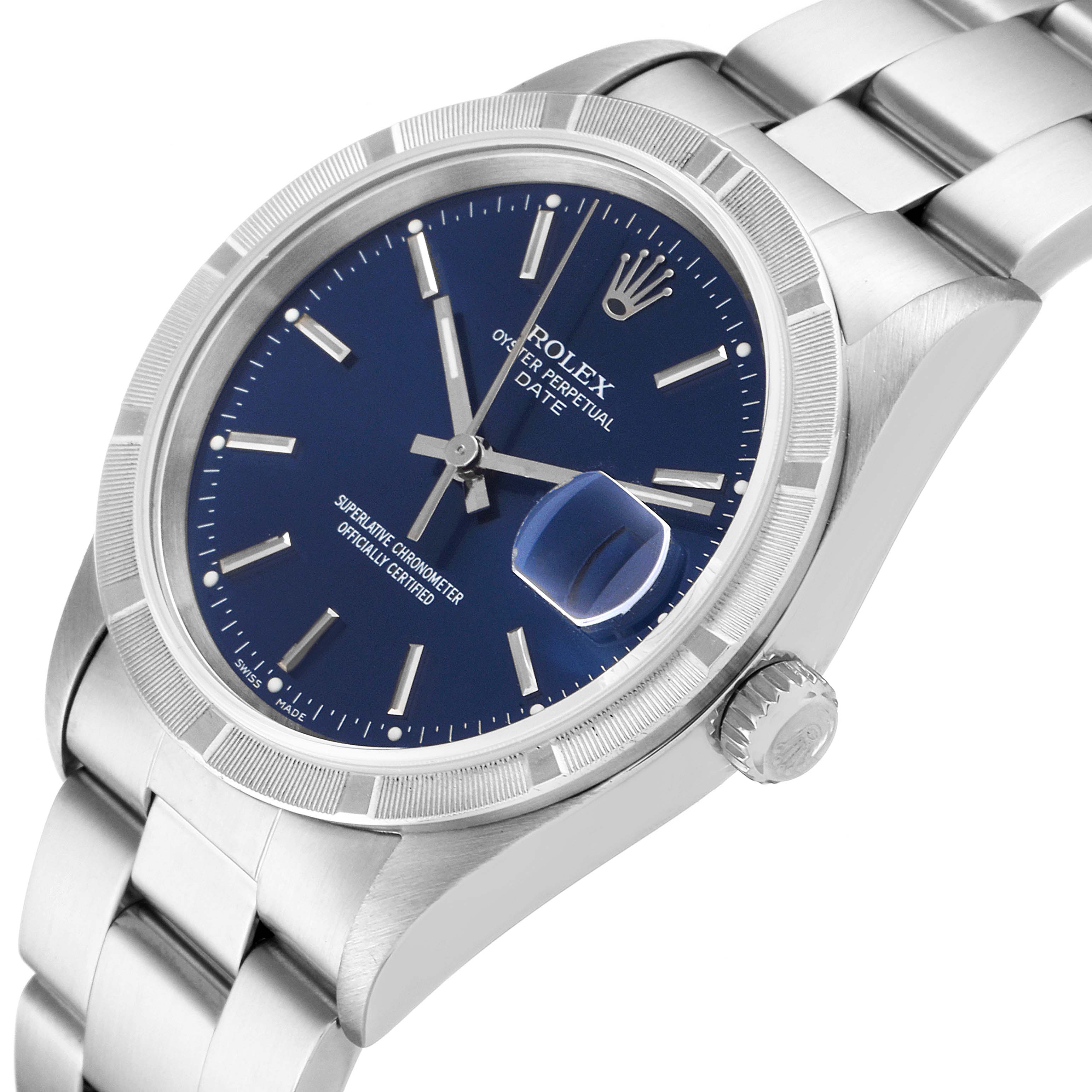 The image shows a Rolex Date 15210 Men's Stainless Steel Blue Dial 15210 Men's Stainless Steel Blue Dial model at an angle highlighting the blue dial, fluted bezel, crown, and bracelet.