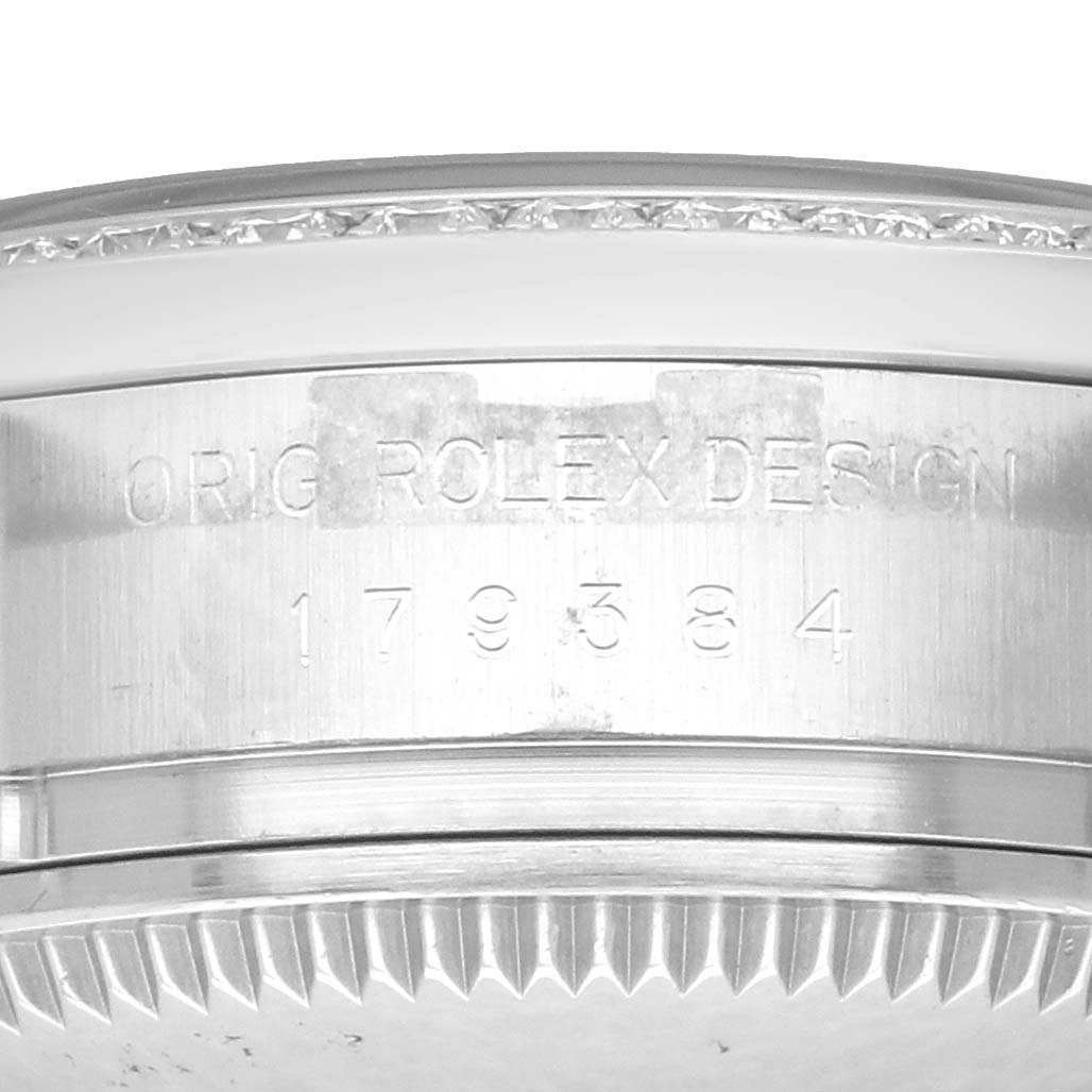 The image shows the side view of the Rolex Datejust 179384 Women's Stainless Steel Black Dial model, highlighting the engraved case details.