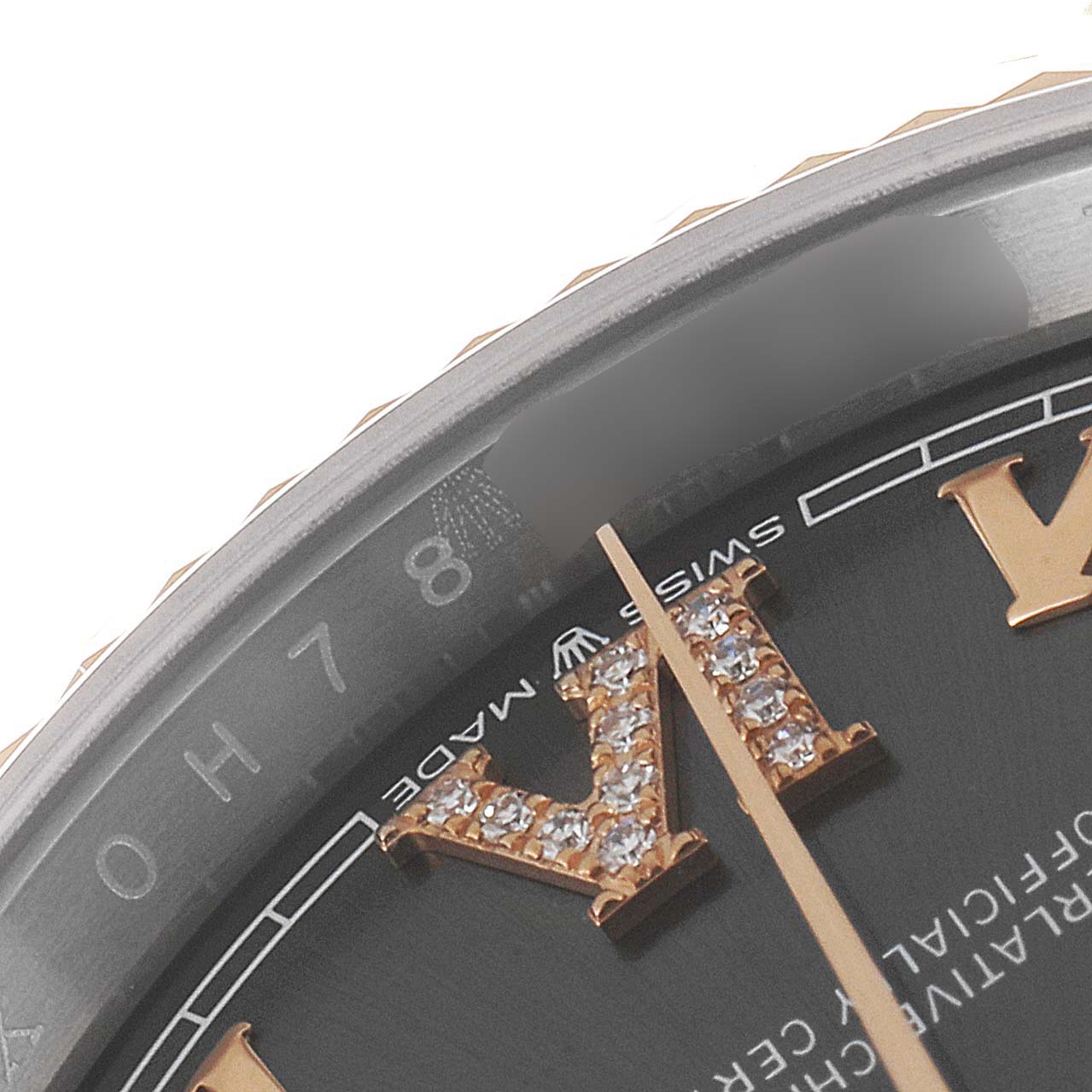 This close-up image shows the dial, bezel, and part of the minute hand of a Rolex Datejust 126231 Men's Steel and Gold (two tone) Mother of Pearl Dial 126231 Men's Steel and Gold (two tone) Mother of Pearl Dial watch.