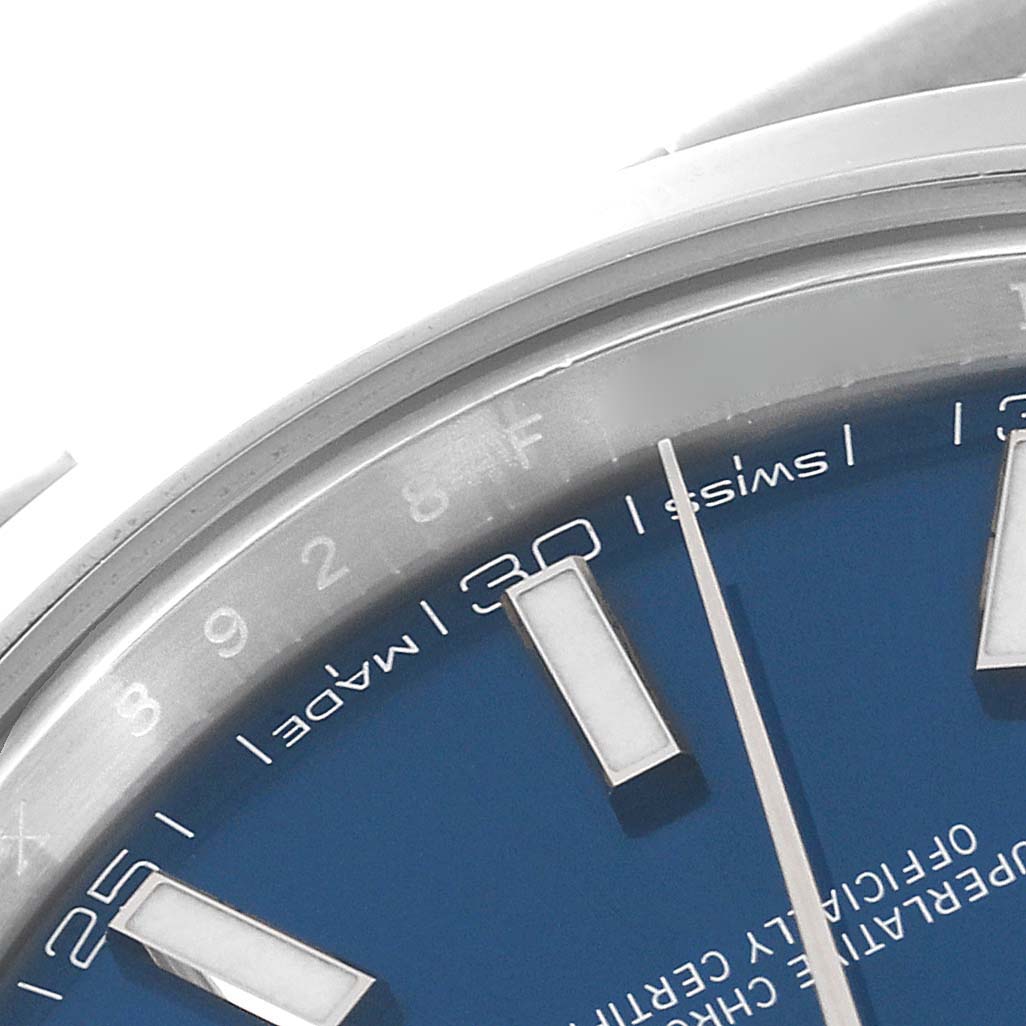 The image shows a close-up of the blue dial and stick markers of a Rolex Datejust 41 126300 Men
s Stainless Steel Blue Dial 126300 Men
s Stainless Steel Blue Dial watch, including part of the "Swiss Made" text.