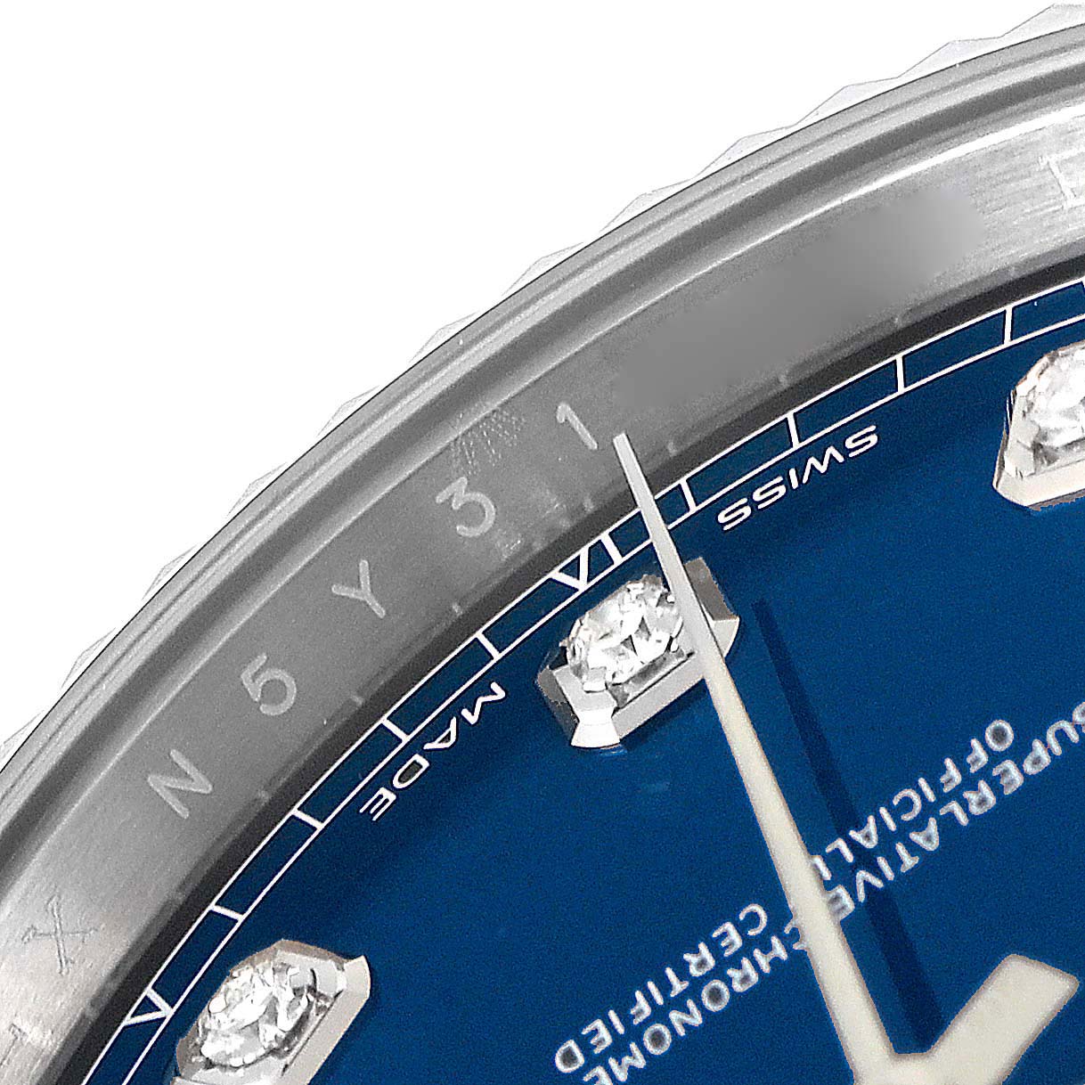 The image shows a close-up angled view of the bezel, minute markers, and dial with diamond hour markers of the Rolex Datejust 41 126334 Men's Stainless Steel Blue Dial 126334 Men's Stainless Steel Blue Dial.