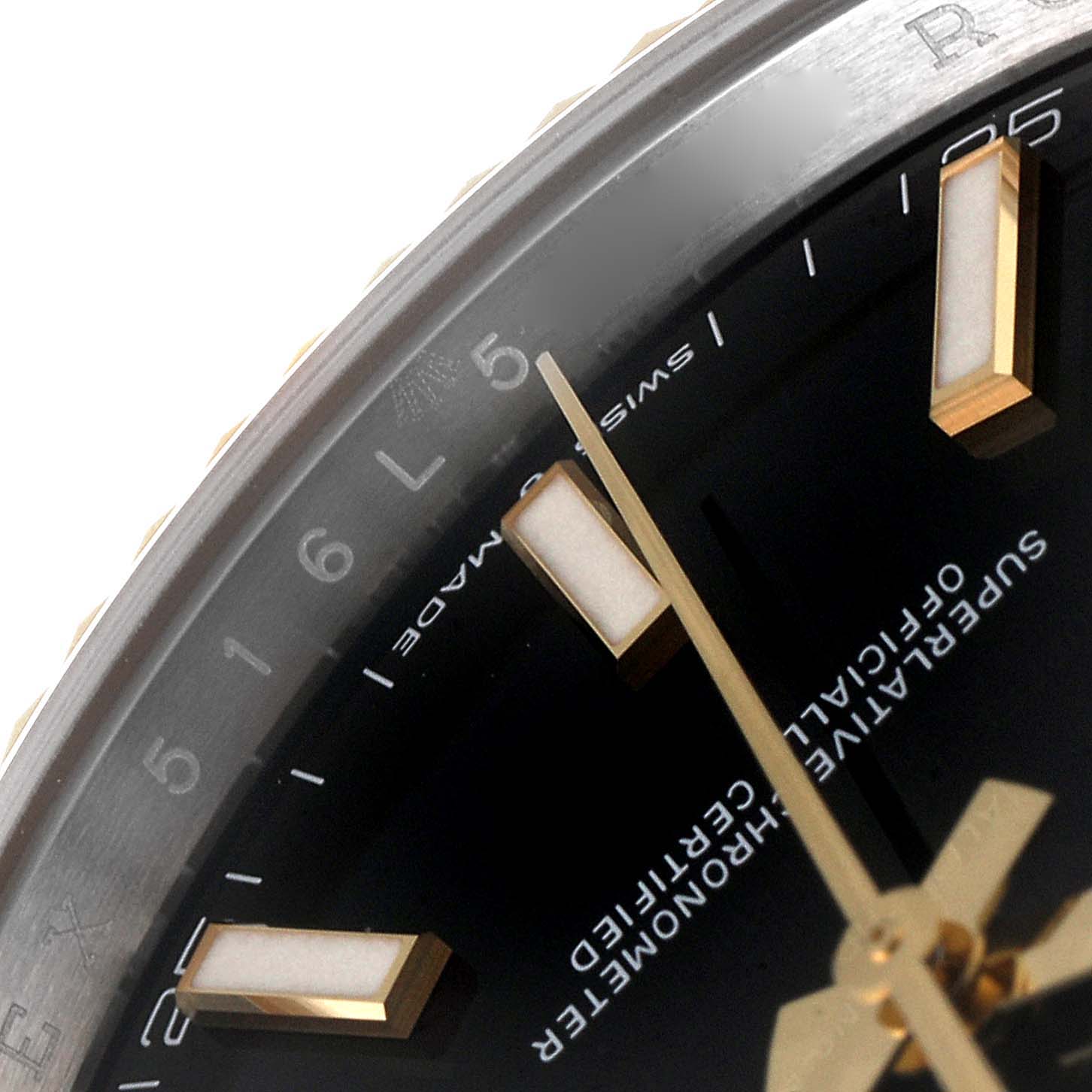A close-up angle of the dial and bezel of the Rolex Datejust 41 126333 Men's Steel and Gold (two tone) Black Dial 126333 Men's Steel and Gold (two tone) Black Dial, showing hour markers and text.