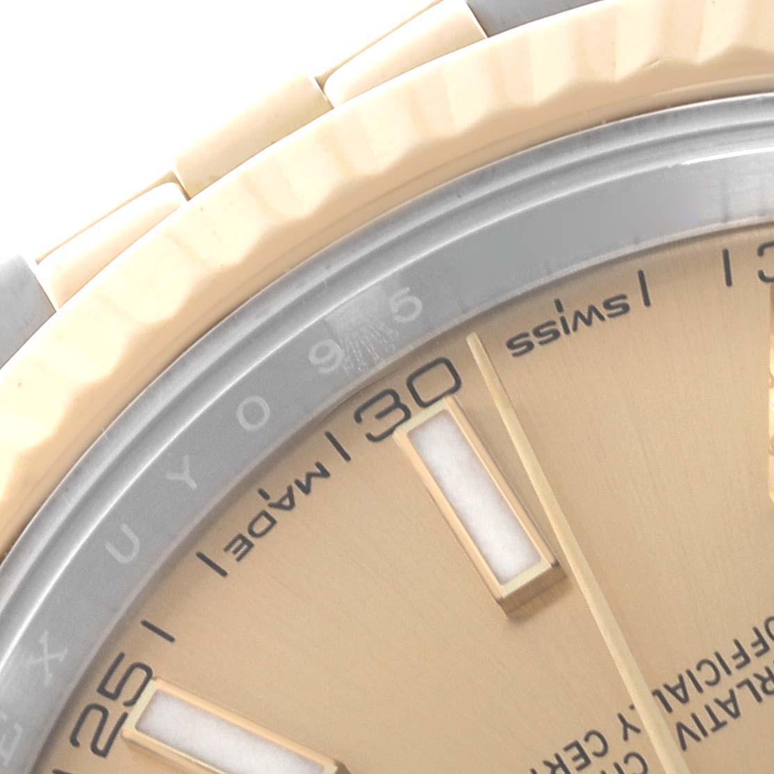 The image shows a close-up of the dial and bezel of the Rolex Datejust 41 126333 Men's Steel and Gold (two tone) Champagne Dial 126333 Men's Steel and Gold (two tone) Champagne Dial, focusing on the indices and part of the bracelet.