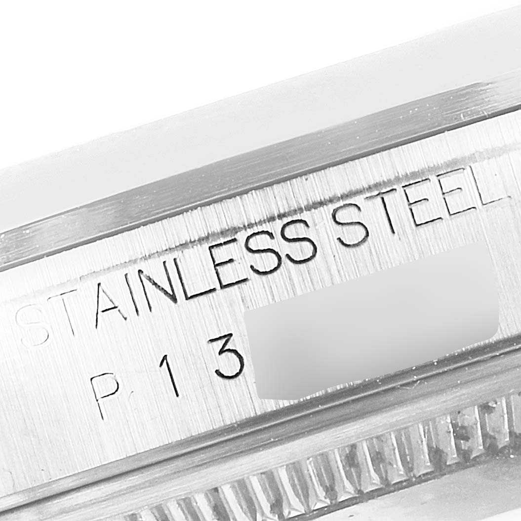 This image shows a close-up of the Rolex Datejust 16200 Men
s Stainless Steel Blue Dial 16200 Men
s Stainless Steel Blue Dial watch case featuring "STAINLESS STEEL" engraving.